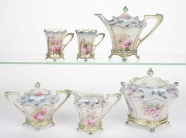 R.S. PRUSSIA PORCELAIN FLORAL MOTIF SIX-PIECE PARTIAL TEA SET