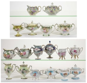 R.S. PRUSSIA PORCELAIN FLORAL MOTIF CREAMER AND SUGAR BOWL SETS, LOT OF NINE