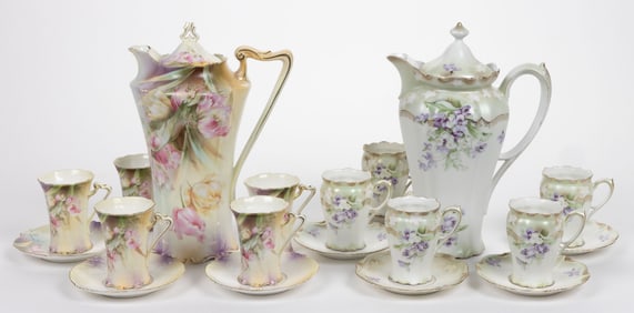 R.S. PRUSSIA PORCELAIN FLORAL MOTIF TWO PARTIAL CHOCOLATE SETS, LOT OF 20 PIECES