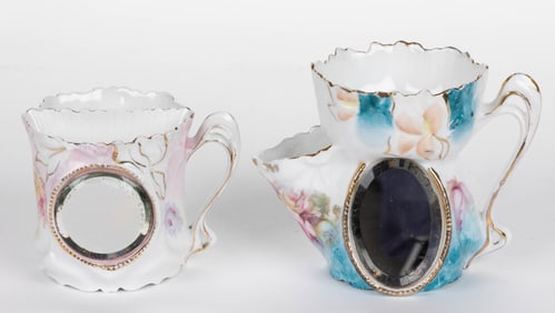R.S. PRUSSIA-STYLE PORCELAIN FLORAL MOTIF SHAVING MUGS, LOT OF TWO