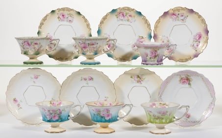 R.S. PRUSSIA PORCELAIN FLORAL MOTIF CUP AND SAUCER SETS, LOT OF SIX