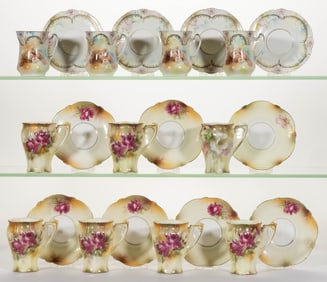 R.S. PRUSSIA PORCELAIN FLORAL MOTIF CHOCOLATE CUP AND SAUCER SETS, LOT OF 11