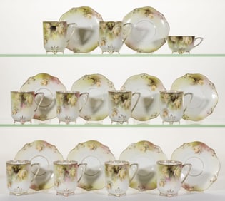 R.S. PRUSSIA PORCELAIN FLORAL MOTIF CHOCOLATE CUP AND SAUCER SETS, LOT OF TEN