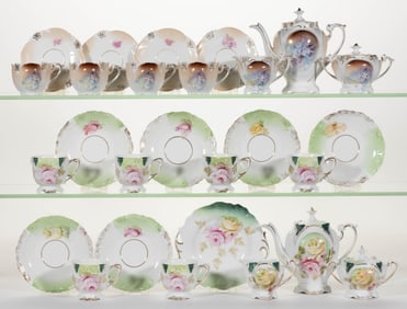 R.S PRUSSIA PORCELAIN FLORAL MOTIF CHILDREN'S TWO PARTIAL TOY TEA SETS, LOT OF 27 PIECES