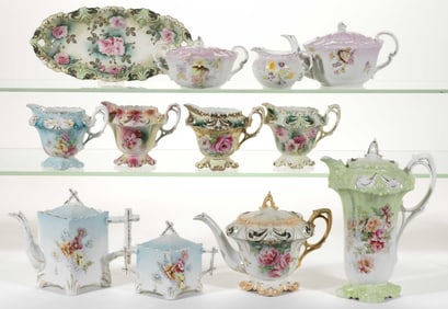 R.S. PRUSSIA PORCELAIN FLORAL MOTIF COFFEE AND TEA ARTICLES, LOT OF 12