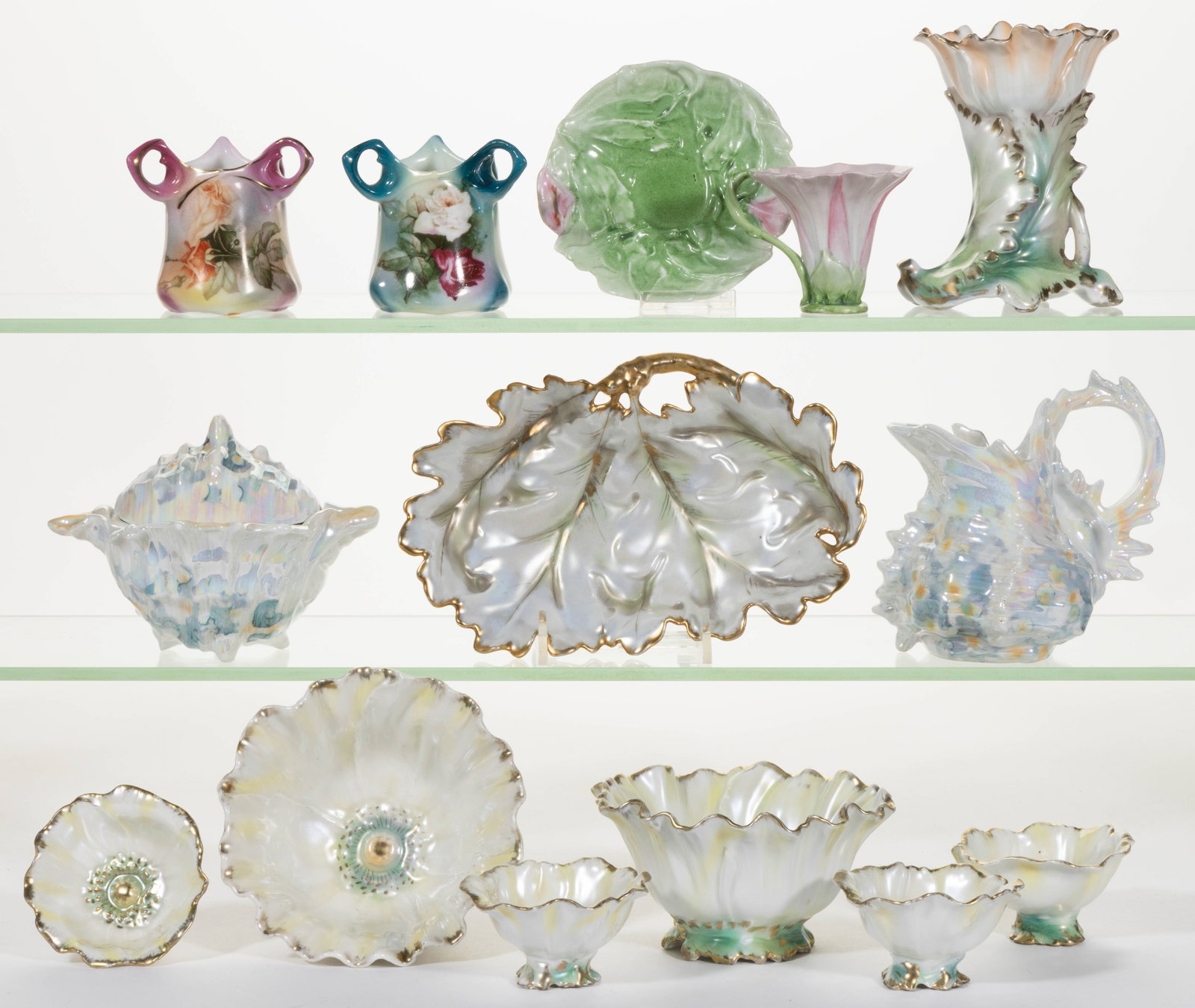 ROYAL BAYREUTH PORCELAIN FIGURAL AND OTHER ARTICLES, LOT OF 12: ROYAL BAYREUTH PORCELAIN FIGURAL AND OTHER ARTICLES, LOT OF 12, comprising seven poppy-form satin finish examples including an apricot hat pin holder and six nut bowls including two master and four in