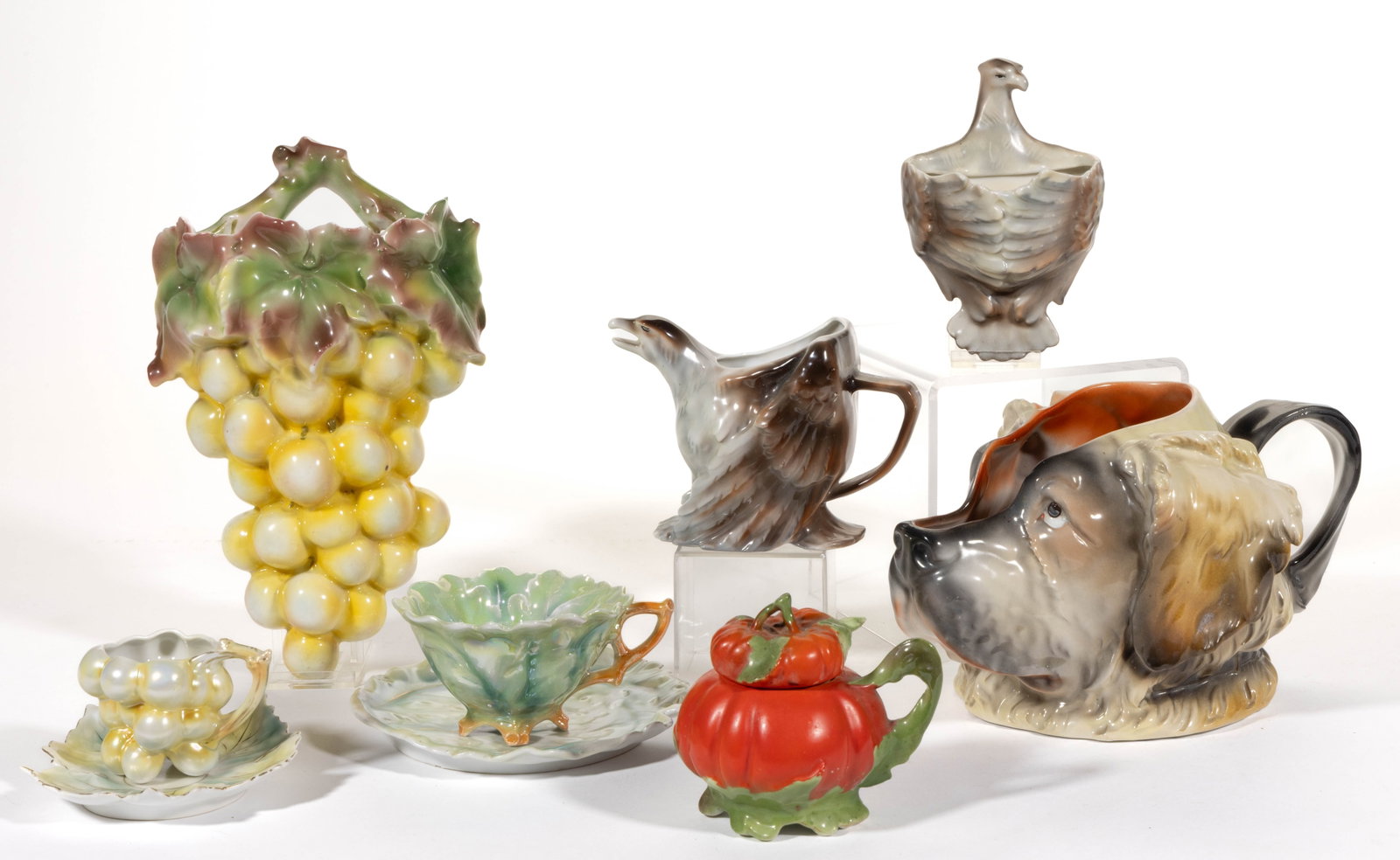 ROYAL BAYREUTH PORCELAIN FIGURAL ARTICLES, LOT OF SEVEN: ROYAL BAYREUTH PORCELAIN FIGURAL ARTICLES, LOT OF SEVEN, comprising a Saint Bernard dog's head water pitcher, two eagle examples including a cream pitcher and a match holder, a covered tomato mustard 