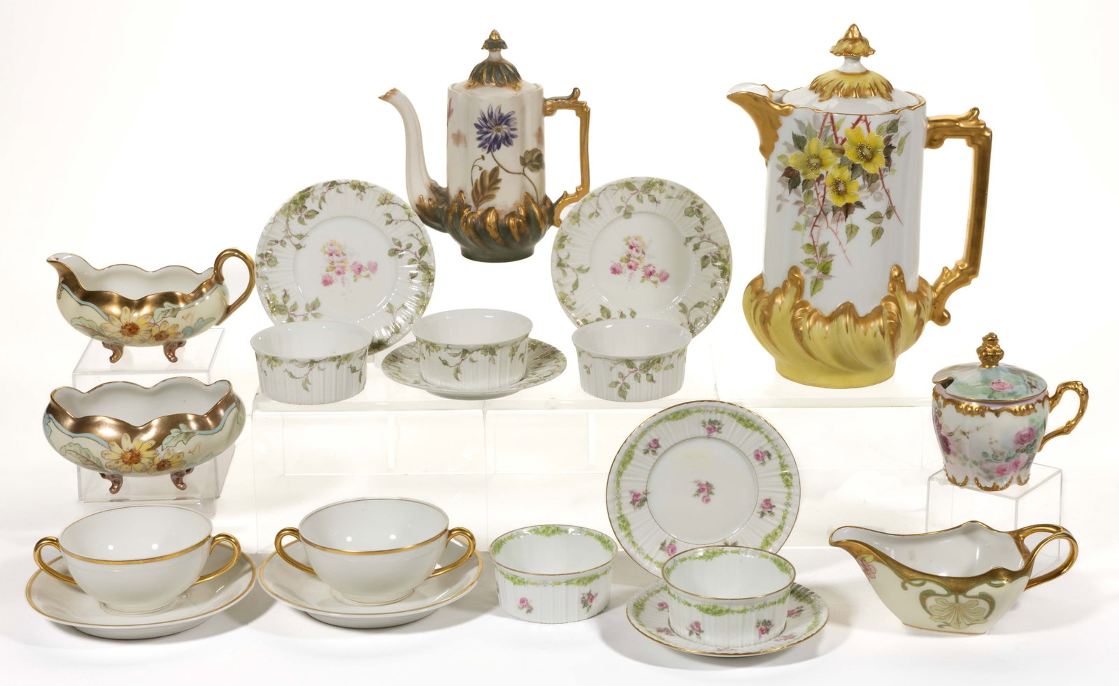 FRENCH LIMOGES PORCELAIN TABLE AND OTHER ARTICLES, LOT OF 13: FRENCH LIMOGES PORCELAIN TABLE AND OTHER ARTICLES, LOT OF 13, including a chocolate pot featuring hand-painted yellow and brown flowers, signed "Cora A. Barrett." to underside, a diminutive lobe-forme