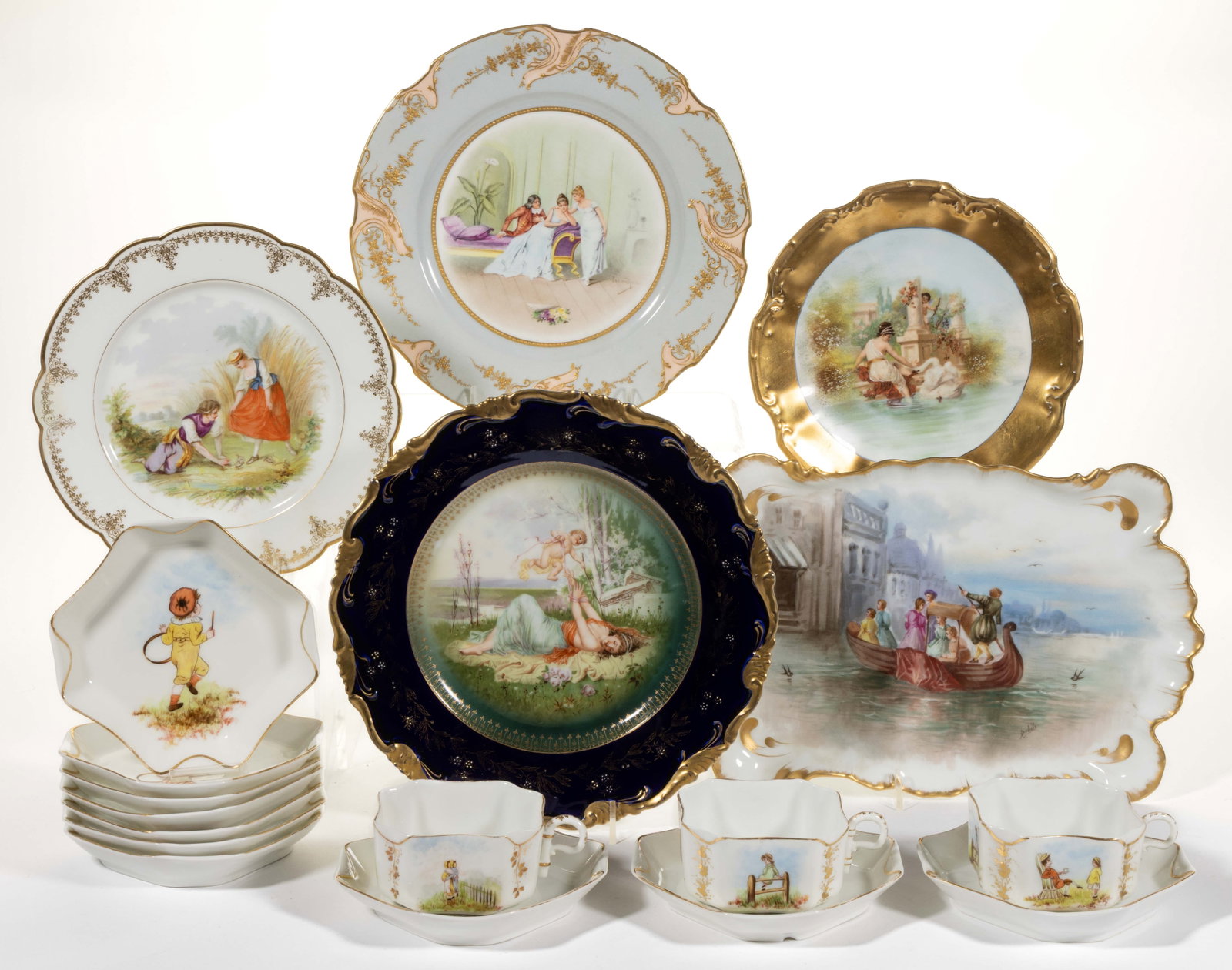 FRENCH / GERMAN PORCELAIN FIGURE MOTIF PLATES AND OTHER ARTICLES, LOT OF 18: FRENCH / GERMAN PORCELAIN FIGURE MOTIF PLATES AND OTHER ARTICLES, LOT OF 18, comprising a 13-piece partial set featuring polychrome hand-painted images of young people including some playing games con