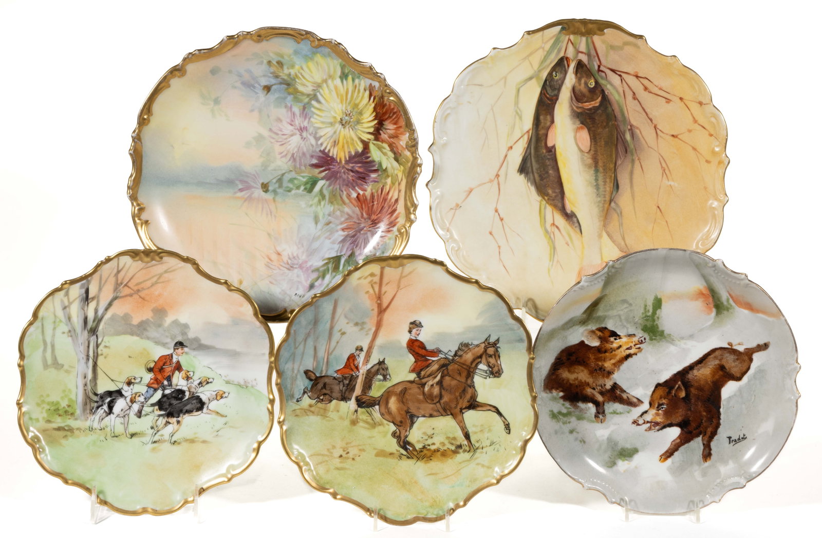 FRENCH LIMOGES PORCELAIN ANIMAL / SCENIC MOTIF PLAQUES, LOT OF FIVE: FRENCH LIMOGES PORCELAIN ANIMAL / SCENIC MOTIF PLAQUES, LOT OF FIVE, each having holes to foot rings for hanging, comprising one example signed "Pradet" depicting two running boar, one example featuri