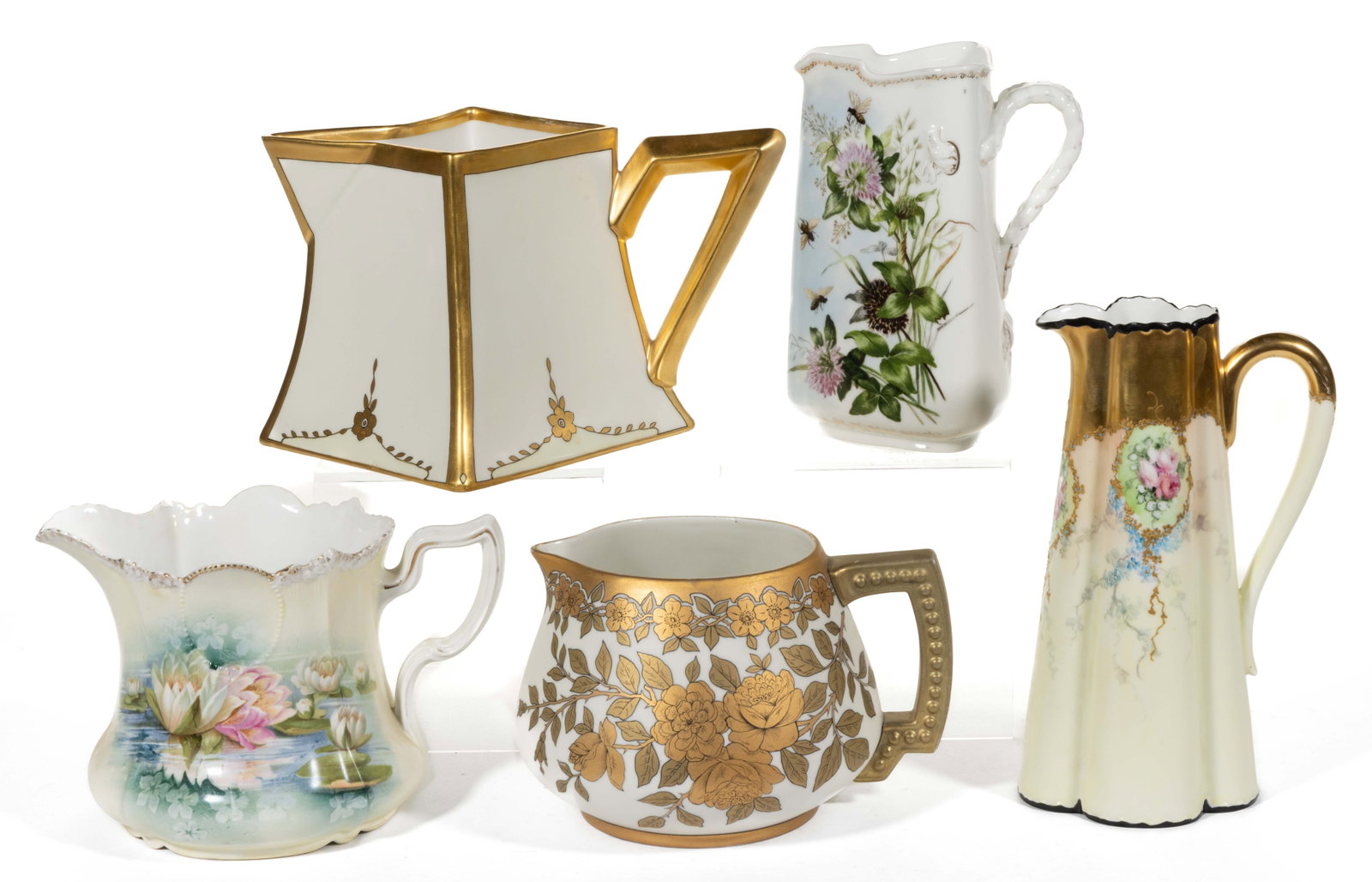 FRENCH LIMOGES / R.S. PRUSSIA PORCELAIN FLORAL MOTIF JUGS / PITCHERS, LOT OF FIVE: FRENCH LIMOGES / R.S. PRUSSIA PORCELAIN FLORAL MOTIF JUGS / PITCHERS, LOT OF FIVE, comprising four Limoges examples including a tall lobed-form example featuring a cartouche with hand-painted rose dec