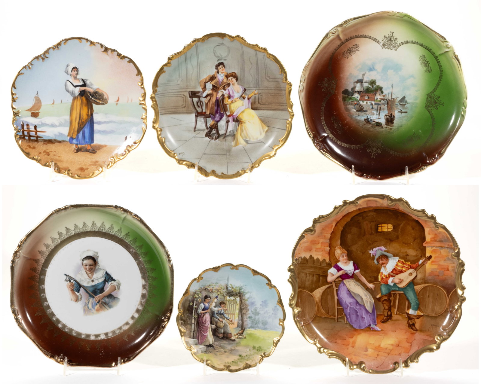 FRENCH LIMOGES PORCELAIN SCENIC / FIGURES MOTIF ARTICLES, LOT OF SIX: FRENCH LIMOGES PORCELAIN SCENIC / FIGURES MOTIF ARTICLES, LOT OF SIX, comprising four plaques having holes to foot rings for hanging including one example featuring a standing Dutch woman holding a ba
