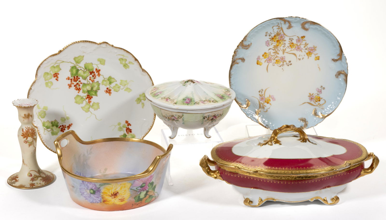FRENCH LIMOGES PORCELAIN TABLE AND OTHER ARTICLES, LOT OF SIX: FRENCH LIMOGES PORCELAIN TABLE AND OTHER ARTICLES, LOT OF SIX, comprising an ivory candlestick with floral motif, a tri-footed covered dish having polychrome rose transfer decorations, a signed open-h