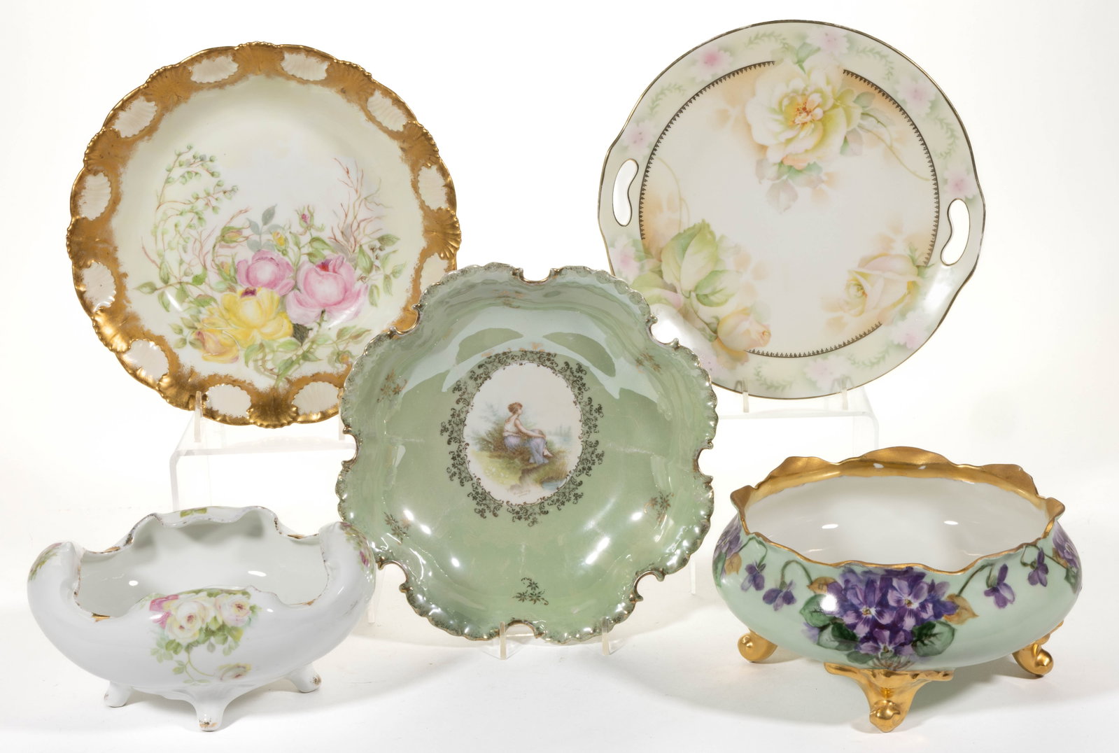 FRENCH LIMOGES / GERMAN PORCELAIN TABLE ARTICLES, LOT OF FIVE: FRENCH LIMOGES / GERMAN PORCELAIN TABLE ARTICLES, LOT OF FIVE, comprising an Erdmann Schlegelmilch Prussia open-handle cake plate having yellow rose motif, two Rosenthal bowls including one footed ovo