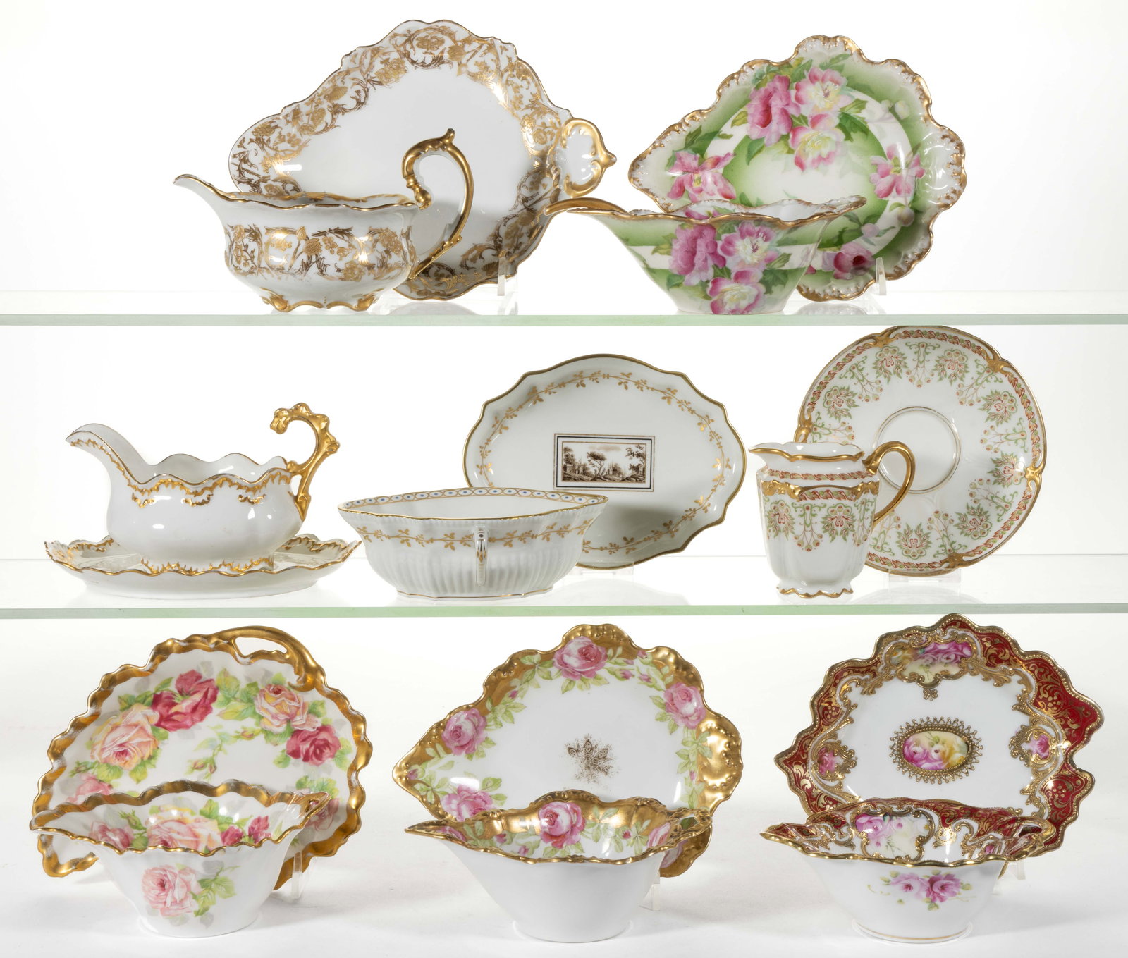 ASSORTED PORCELAIN TEA AND TABLE ARTICLES, LOT OF NINE: ASSORTED PORCELAIN TEA AND TABLE ARTICLES, LOT OF NINE, comprising eight sets with undertray/saucer consisting of one creamer example having Art Nouveau-style scrolled designs and seven sauce or mayon