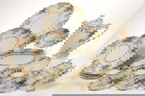 GERMAN PORCELAIN OLD IVORY XXII HOLLY MOTIF ASSORTED ARTICLES, LOT OF 17: GERMAN PORCELAIN OLD IVORY XXII HOLLY MOTIF ASSORTED ARTICLES, LOT OF 17, each having a white center with gilt transfer decoration and cream border featuring green holly with red berries, comprising a