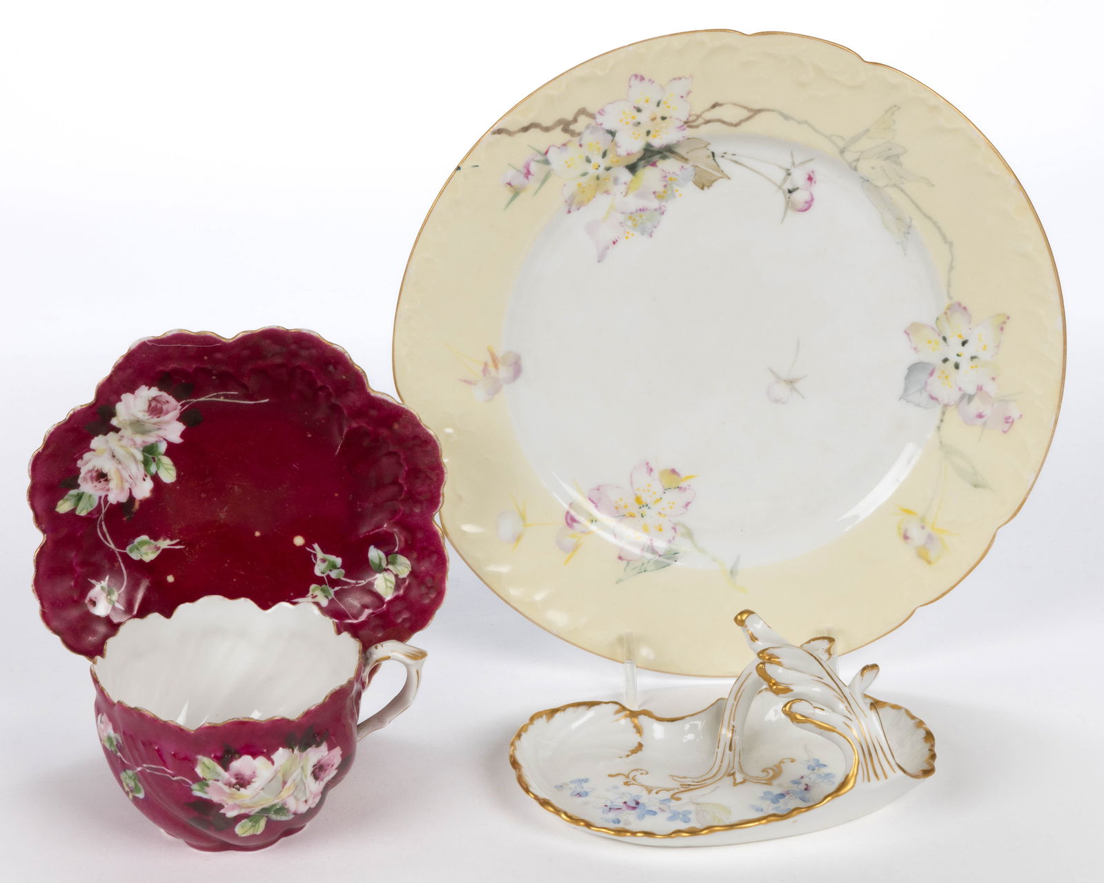 FRENCH / AMERICAN PAIRPOINT LIMOGES HAND-PAINTED PORCELAIN ARTICLES, LOT OF THREE: FRENCH / AMERICAN PAIRPOINT LIMOGES HAND-PAINTED PORCELAIN ARTICLES, LOT OF THREE, each having polychrome floral decorations, comprising a 8 1/2" D plate with light yellow border, a cup and saucer set