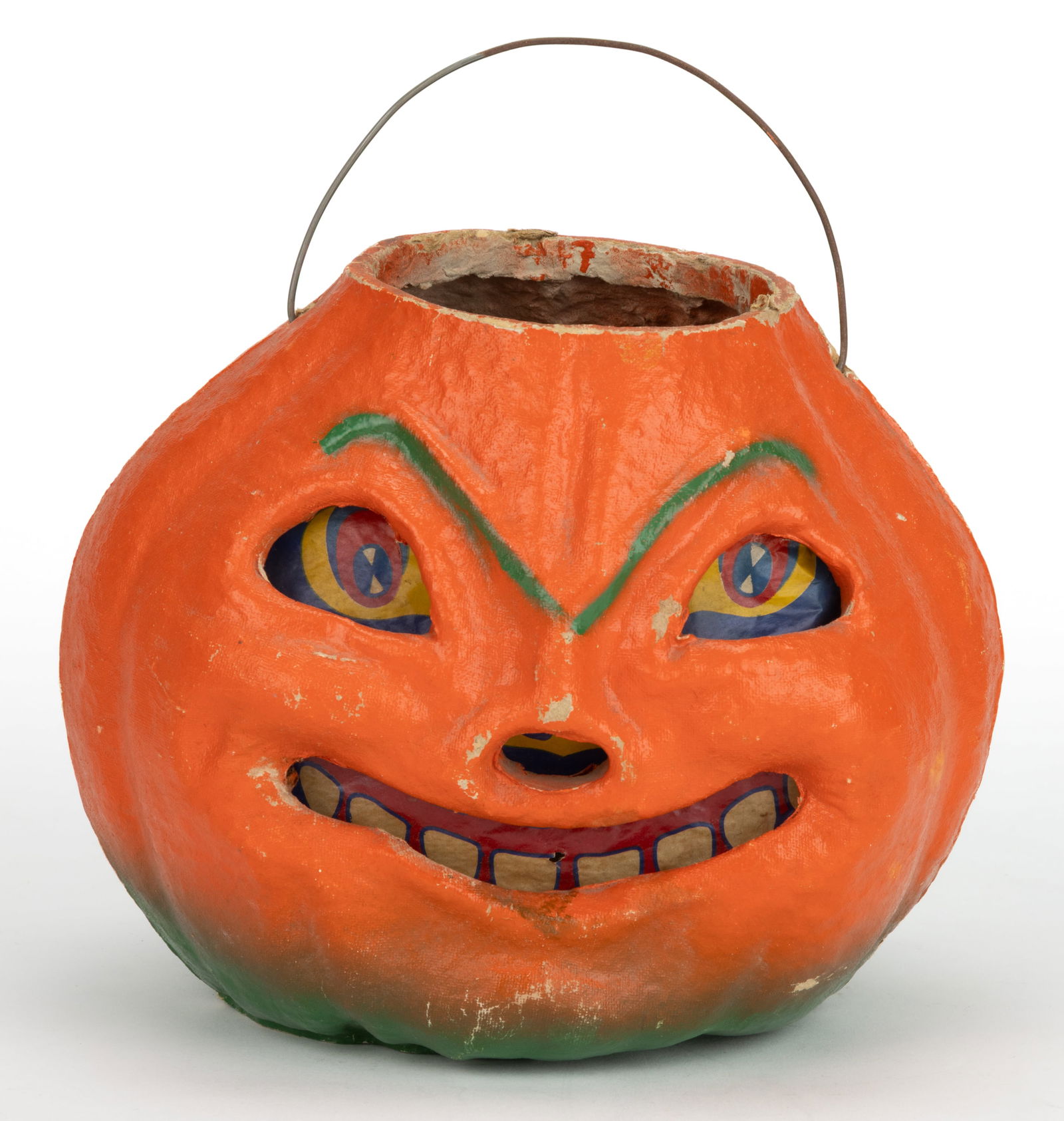 AMERICAN PAPIER-MACHE / PULP HALLOWEEN JACK-O-LANTERN: AMERICAN PAPIER-MACHE / PULP HALLOWEEN JACK-O-LANTERN, depicting a smiling jack-o-lantern with a green-to-orange paint decoration. Retains the likely original liner / face. Circa 1950. 6 1/2" HOA