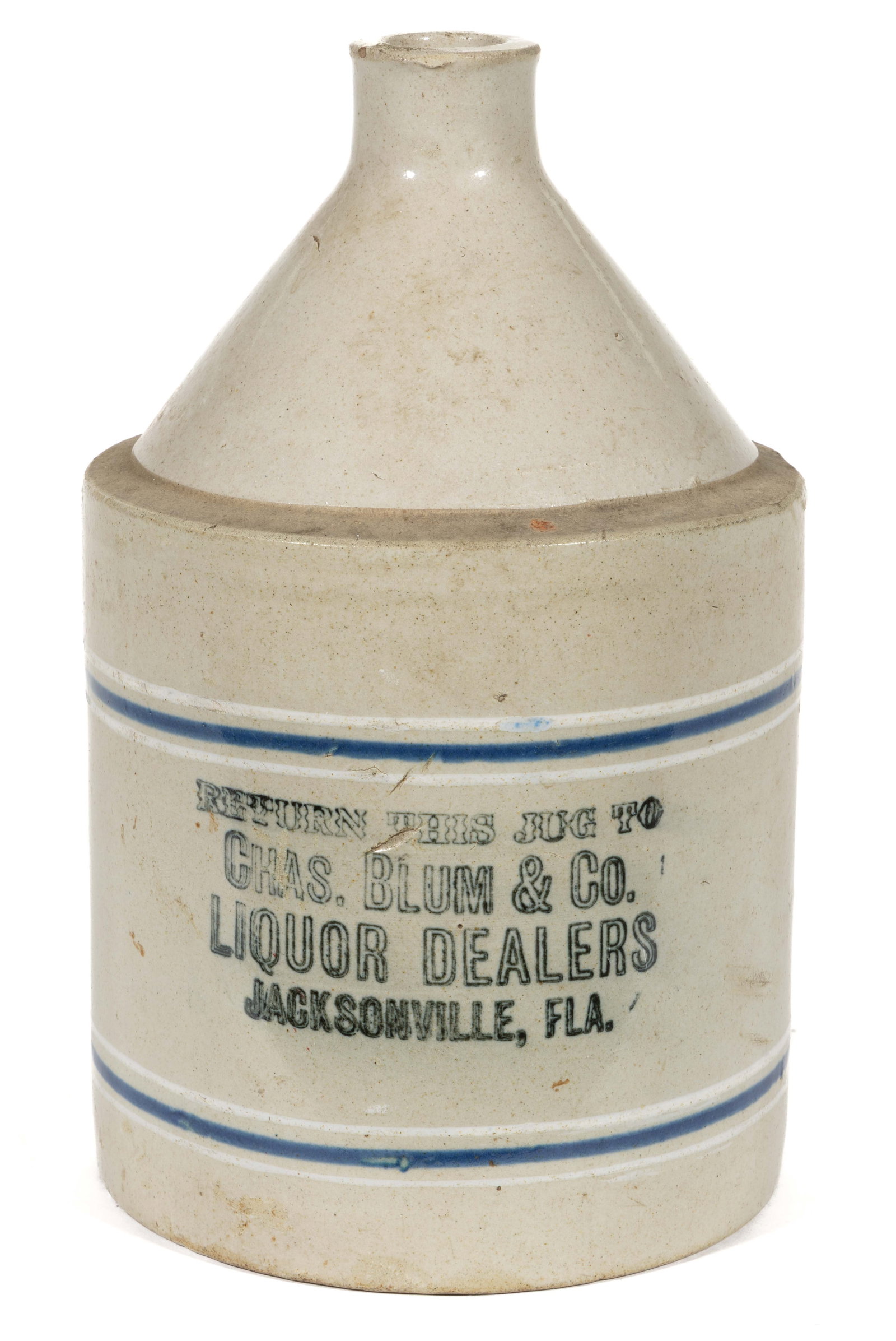 JACKSONVILLE, FLORIDA MERCHANT'S STONEWARE ADVERTISING JUG: JACKSONVILLE, FLORIDA MERCHANT'S STONEWARE ADVERTISING JUG, Bristol-slip glazed, approximately one-gallon capacity, cylindrical form with sharp conical shoulder, plain spout and applied 