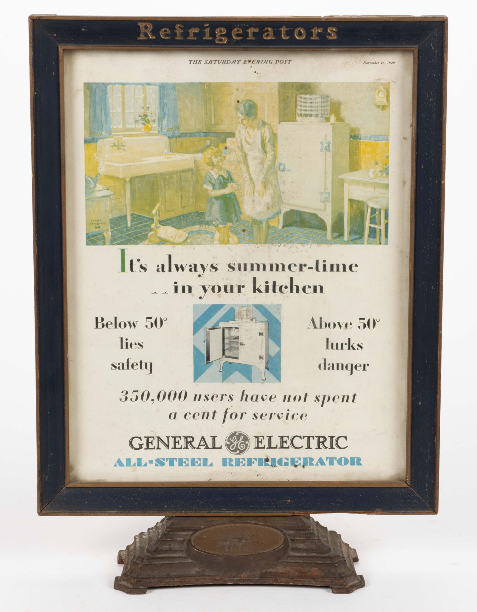 GENERAL ELECTRIC REFRIGERATORS COUNTER-TOP ADVERTISING SIGN: GENERAL ELECTRIC REFRIGERATORS COUNTER-TOP ADVERTISING SIGN, the painted-wood frame with "Refrigerators" across the top, holding a 1929 Saturday Evening Post full-page advertisement, support