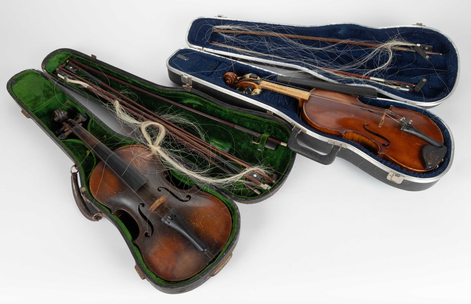 ANTIQUE / VINTAGE VIOLINS, LOT OF TWO: ANTIQUE / VINTAGE VIOLINS, LOT OF TWO, four string, maple and spruce, each featuring a carved scroll, ebony fingerboard, tail piece, and chin rest. Each with an associated hardshell case and eigh