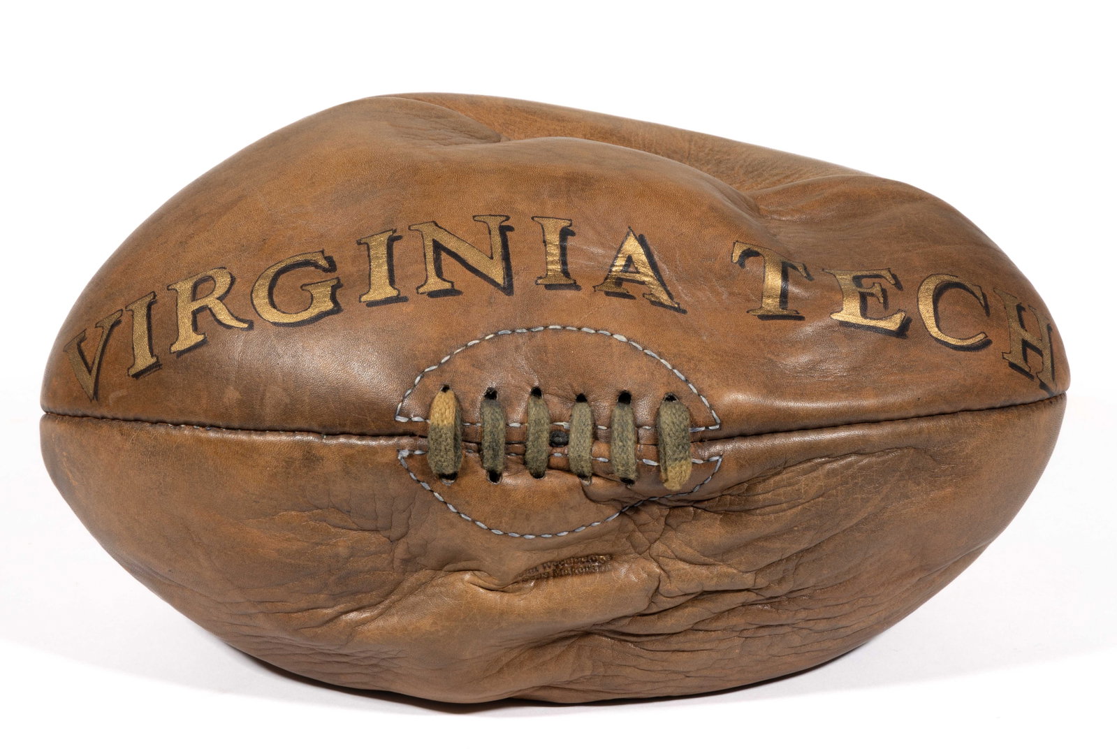 VIRGINIA TECH JOHN WOODBRIDGE & SONS FOOTBALL: VIRGINIA TECH JOHN WOODBRIDGE & SONS FOOTBALL, constructed of four leather panels, retains the likely original laces with maker's stamp below, and above, period gold-painted script reads "