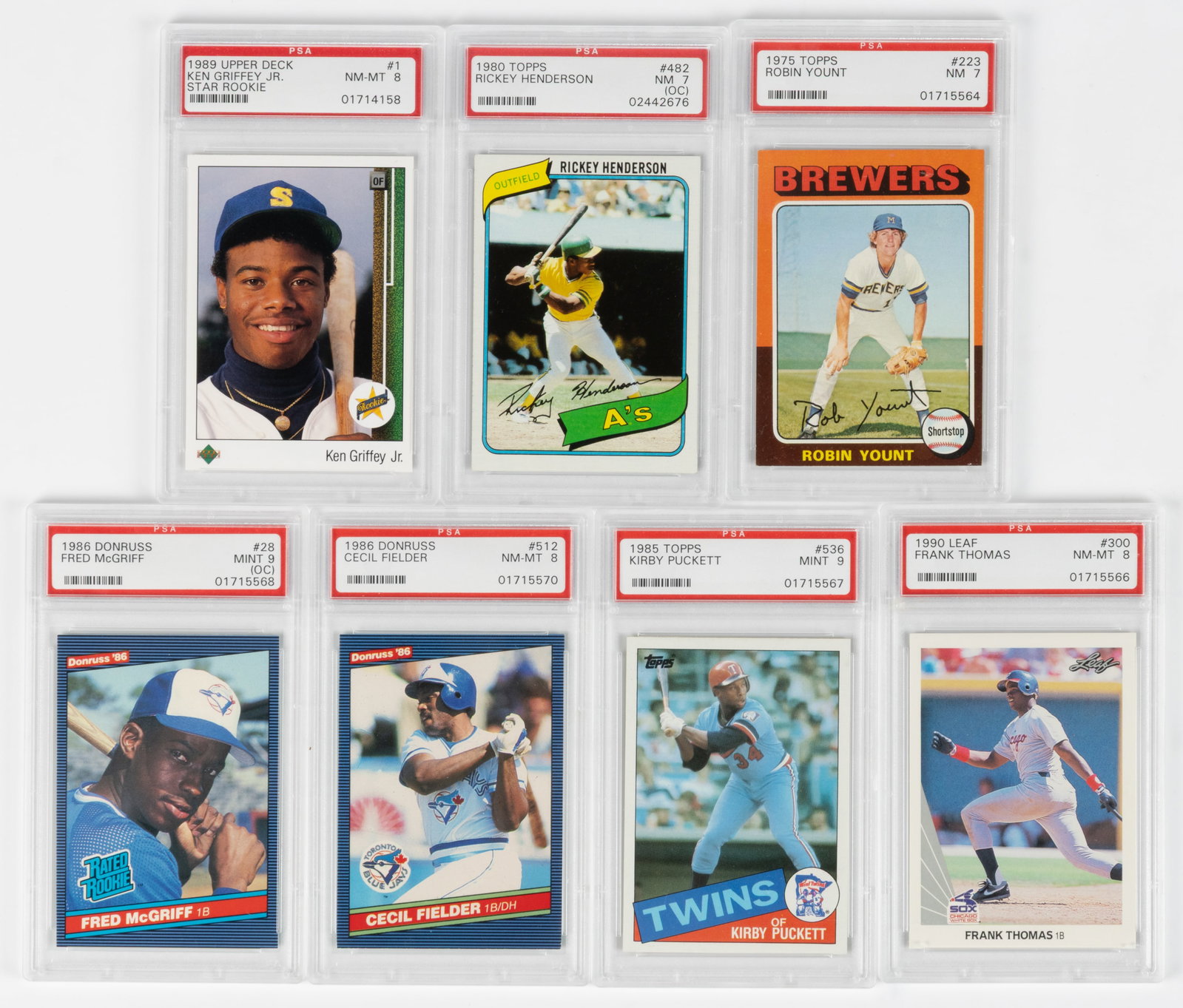 ASSORTED ROOKIE BASEBALL CARDS, LOT OF SEVEN PSA GRADED: ASSORTED ROOKIE BASEBALL CARDS, LOT OF SEVEN PSA GRADED, comprising Topps #223 Robin Yount (NM 7), 1980 Topps #482 Rickey Henderson (NM 7), 1989 Upper Deck #1 Ken Griffey Jr. (NM-MT 8), 1990 Leaf #300
