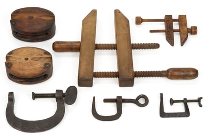 ASSORTED IRON AND WOODEN CLAMPS AND PULLIES, LOT OF SEVEN