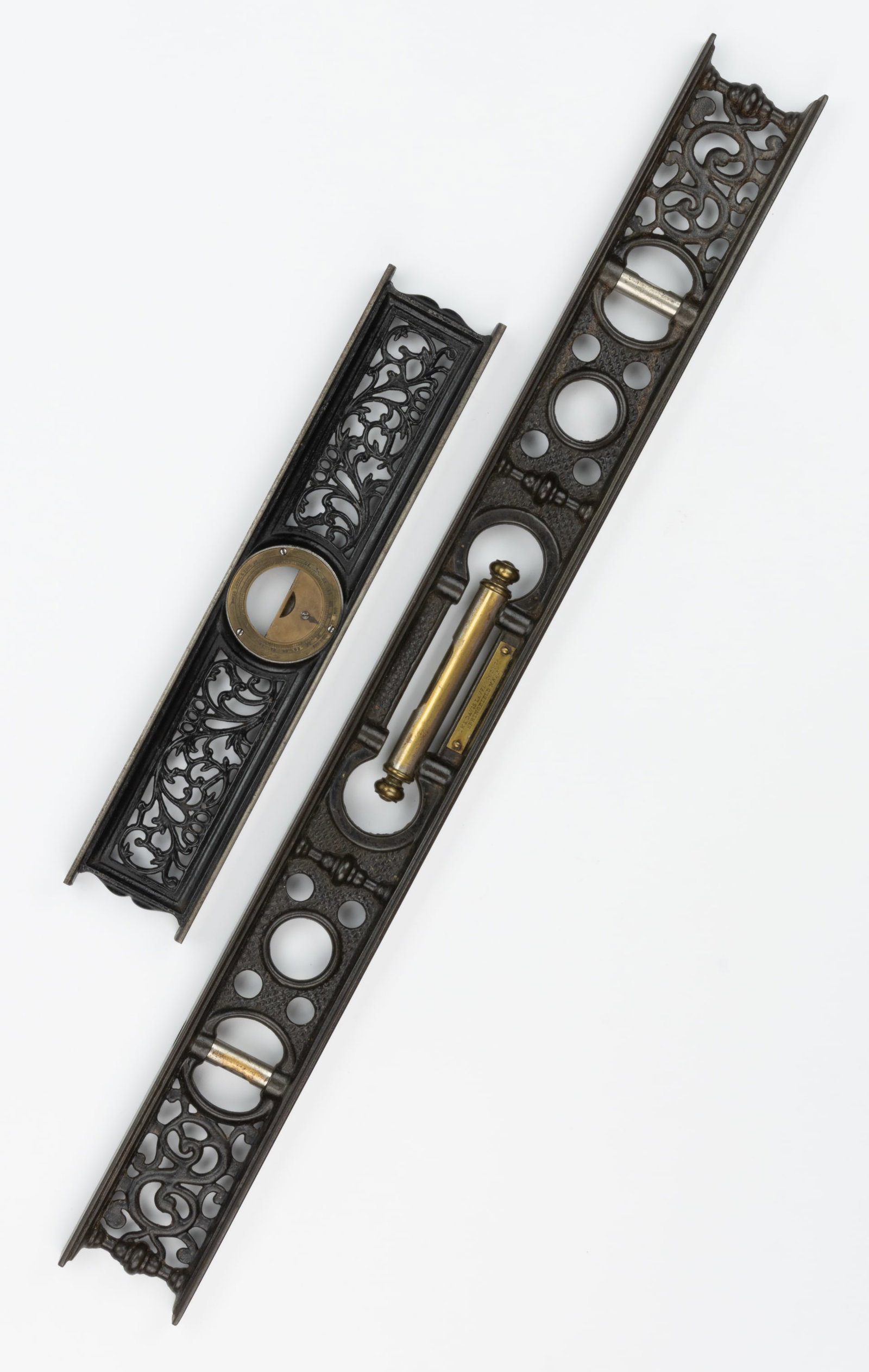 DAVIS TOOL AND LEVEL CO. ASSORTED CAST-IRON AND BRASS LEVELS AND INCLOMETER, LOT OF TWO: DAVIS TOOL AND LEVEL CO. ASSORTED CAST-IRON AND BRASS LEVELS AND INCLOMETER, LOT OF TWO, each with ornate scrolling cast-iron frames, impressed with makers name and patent information, comprising