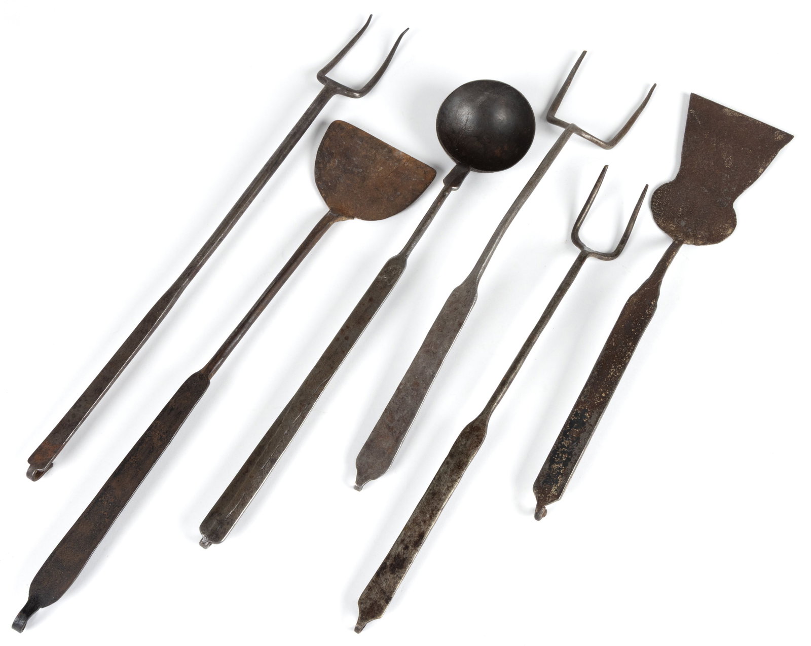 ASSORTED WROUGHT-IRON HEARTH / KITCHEN COOKING UTENSILS, LOT OF SIX: ASSORTED WROUGHT-IRON HEARTH / KITCHEN COOKING UTENSILS, LOT OF SIX, comprising of three double-tine meat forks, two spatulas including one with a figural key-hole blade, and a tasting ladle; each wit