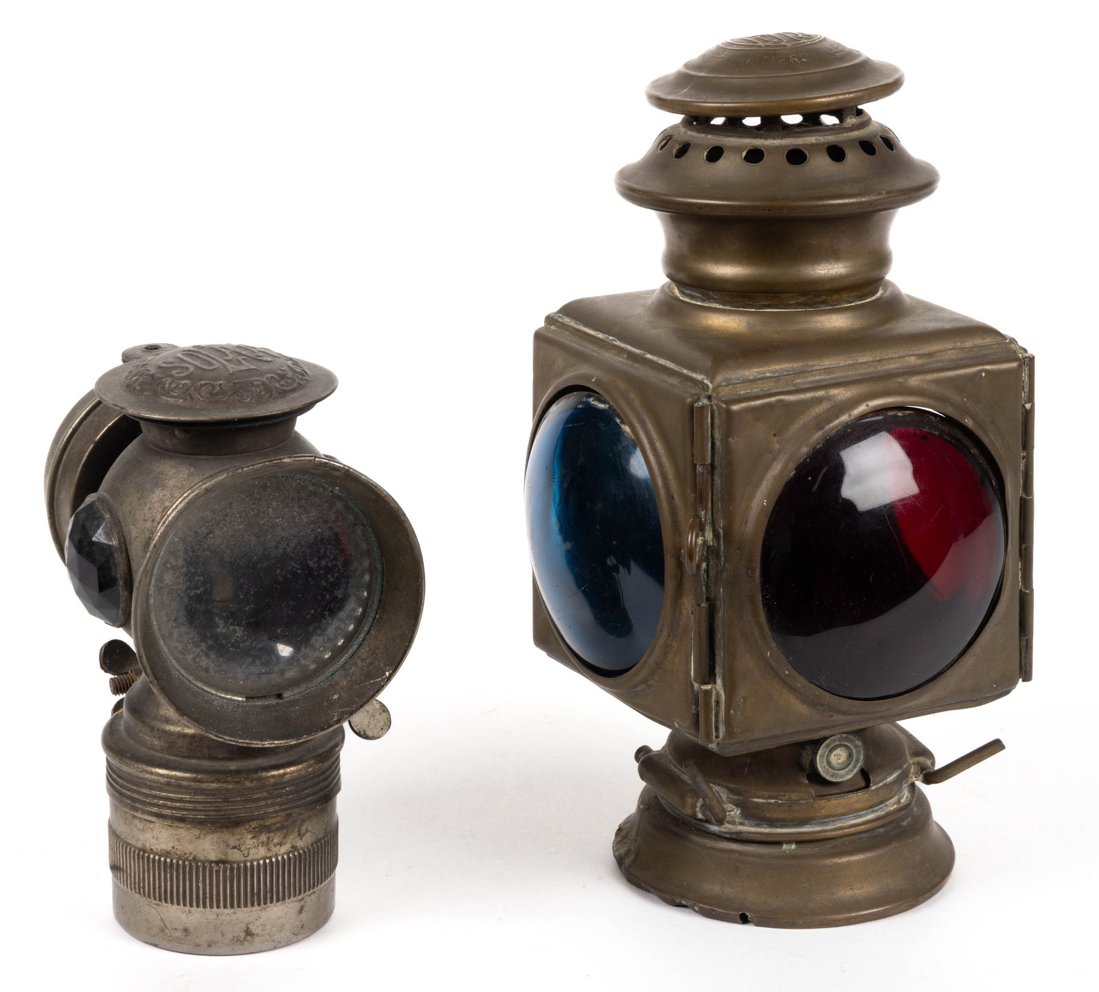 ANTIQUE TRANSPORTATION LANTERNS, LOT OF TWO: ANTIQUE TRANSPORTATION LANTERNS, LOT OF TWO, comprising a brass Indiana Lamp Co. No. 1 automobile/carriage lantern with colorless, green, and red lenses, interior burner is present; and a Badger Brass