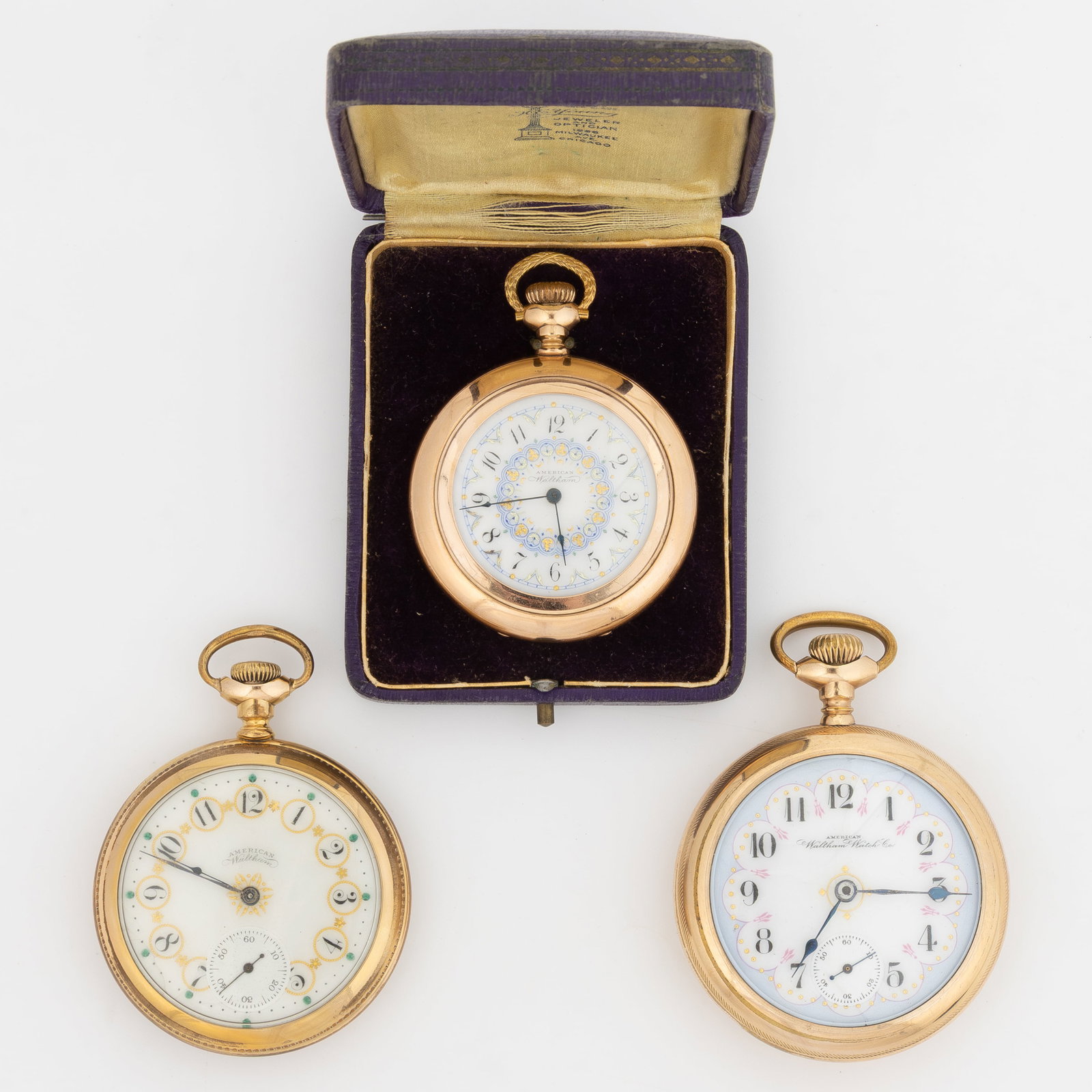 WALTHAM FANCY DIAL POCKET WATCHES, LOT OF THREE: WALTHAM FANCY DIAL POCKET WATCHES, LOT OF THREE, each with pendant-set movement, having a white enamel dial with fancy decoration featuring gilt embellishments, Arabic chapter ring, and blued-steel sp