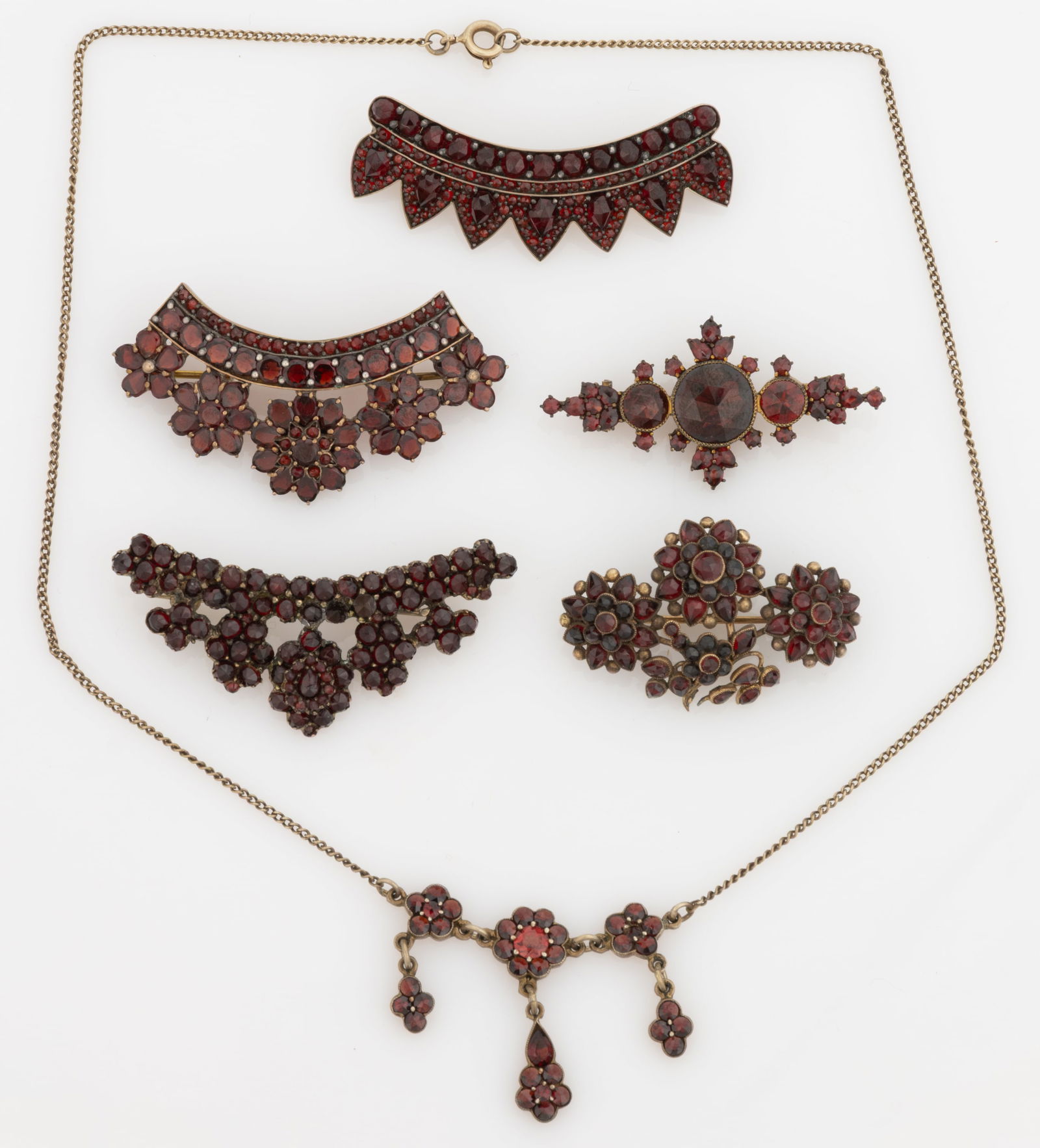 VICTORIAN / ANTIQUE AND VINTAGE GOLD-FILLED AND OTHER GARNET JEWELRY, LOT OF SIX: VICTORIAN / ANTIQUE AND VINTAGE GOLD-FILLED AND OTHER GARNET JEWELRY, LOT OF SIX, each piece set with multiple cut garnet stones, comprising a necklace with flower-form multi-pieced pendant on a thin