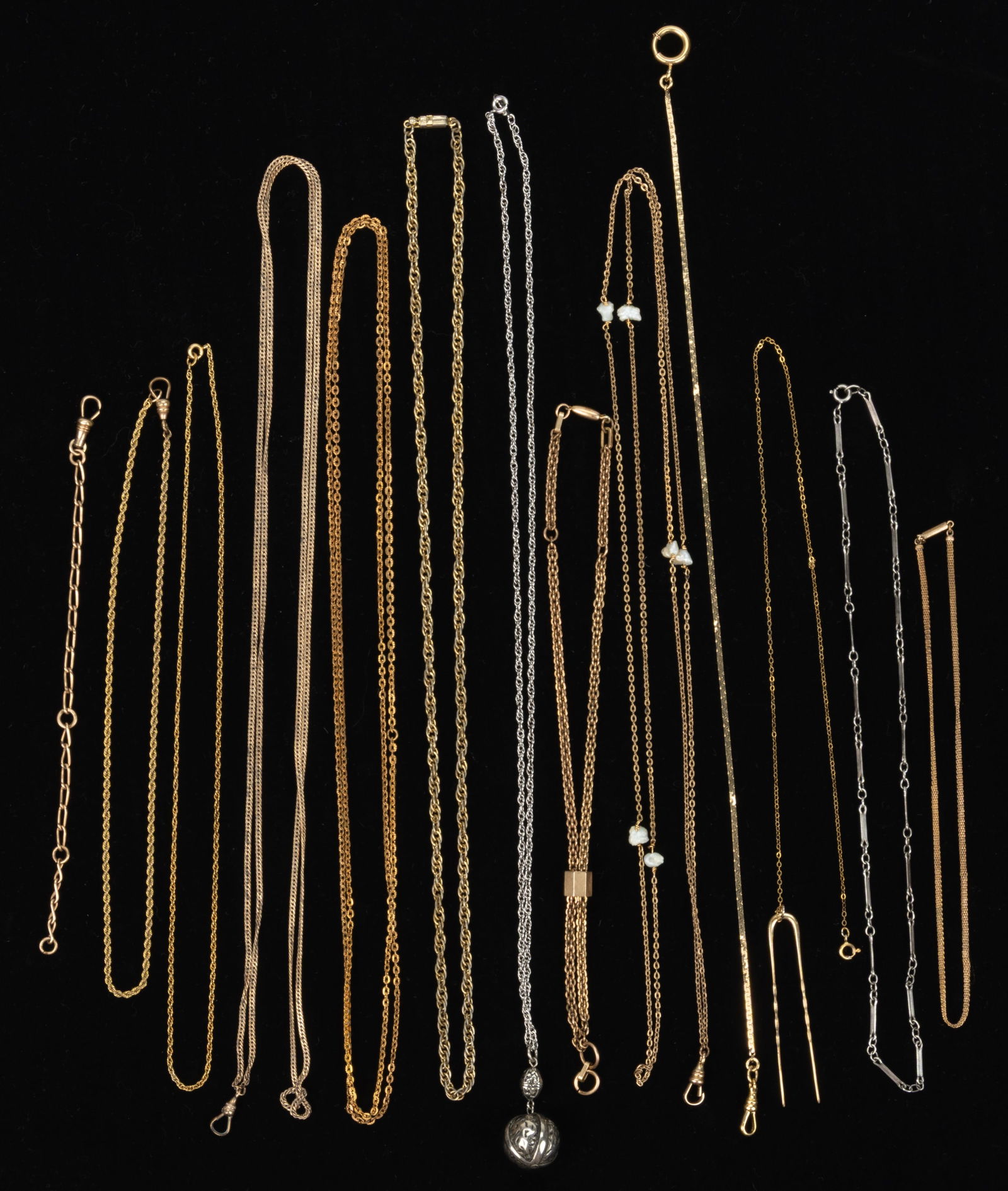 ANTIQUE / VINTAGE GOLD-FILLED AND OTHER NECKLACES AND OTHER CHAINS, LOT OF 13: ANTIQUE / VINTAGE GOLD-FILLED AND OTHER NECKLACES AND OTHER CHAINS, LOT OF 13, including two lady's watch necklace chain including one with six freshwater pearls; three gold-filled/gold-toned chai