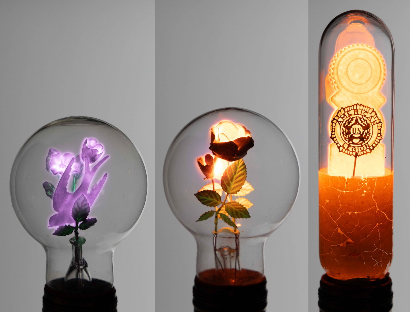 VINTAGE AEROLUX FIGURAL FILAMENT GAS DISCHARGE / NEON GLOW LIGHT BULBS AND LAMPS, LOT OF THREE: VINTAGE AEROLUX FIGURAL FILAMENT GAS DISCHARGE / NEON GLOW LIGHT BULBS AND LAMPS, LOT OF THREE, purple and green or orange and green glows, two marked Aerolux comprising an example with
