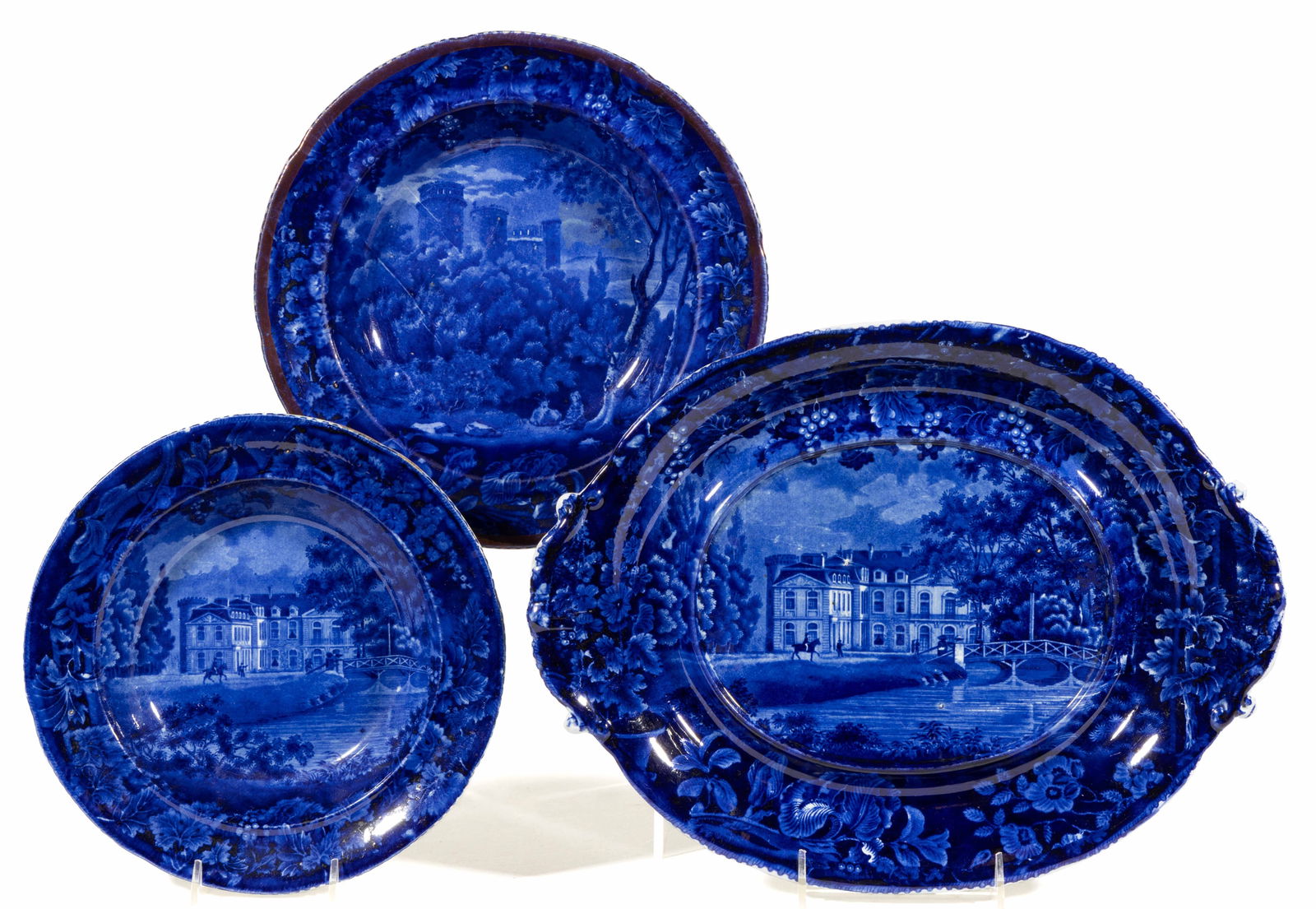 STAFFORDSHIRE FRENCH VIEWS TRANSFER-PRINTED CERAMIC TABLE ARTICLES, LOT OF THREE: STAFFORDSHIRE FRENCH VIEWS TRANSFER-PRINTED CERAMIC TABLE ARTICLES, LOT OF THREE, each having dark blue transfer scenes with floral and fruit border decoration, comprising a soup plate with pink lustr