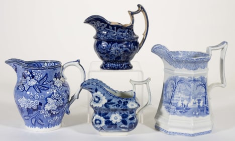 STAFFORDSHIRE BLUE TRANSFER-PRINTED CERAMIC CREAMERS AND JUGS, LOT OF FOUR