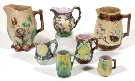 AMERICAN / CONTINENTAL MAJOLICA CERAMIC PITCHERS, LOT OF SEVEN