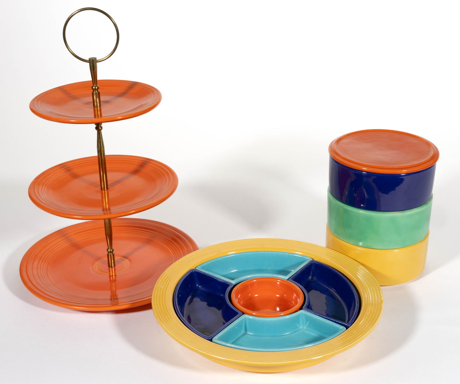 HOMER LAUGHLIN FIESTAWARE CERAMIC TABLE ARTICLES, LOT OF THREE: HOMER LAUGHLIN FIESTAWARE CERAMIC TABLE ARTICLES, LOT OF THREE, comprising a 10 3/4" DOA four-color relish tray with five inserts, a four-color stacking set including three bowls and cover, and a