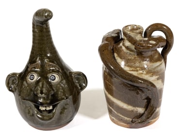 GEORGIA AND NORTH CAROLINA STONEWARE FACE / FOLK JUGS, LOT OF TWO