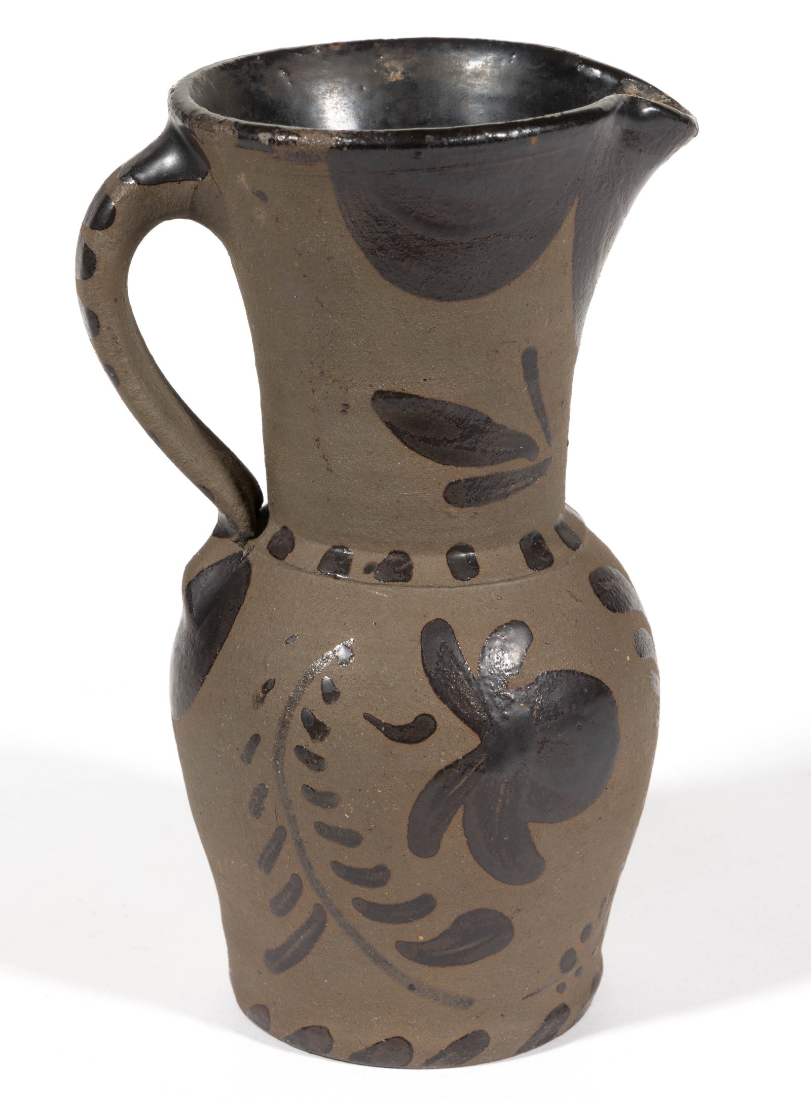 WESTERN PENNSYLVANIA DECORATED TANWARE CREAM PITCHER: WESTERN PENNSYLVANIA DECORATED TANWARE CREAM PITCHER, approximately one-pint capacity, truncated ovoid form with high neck and applied strap handle, Albany-slip glazed interior. Brushed Albany-slip do