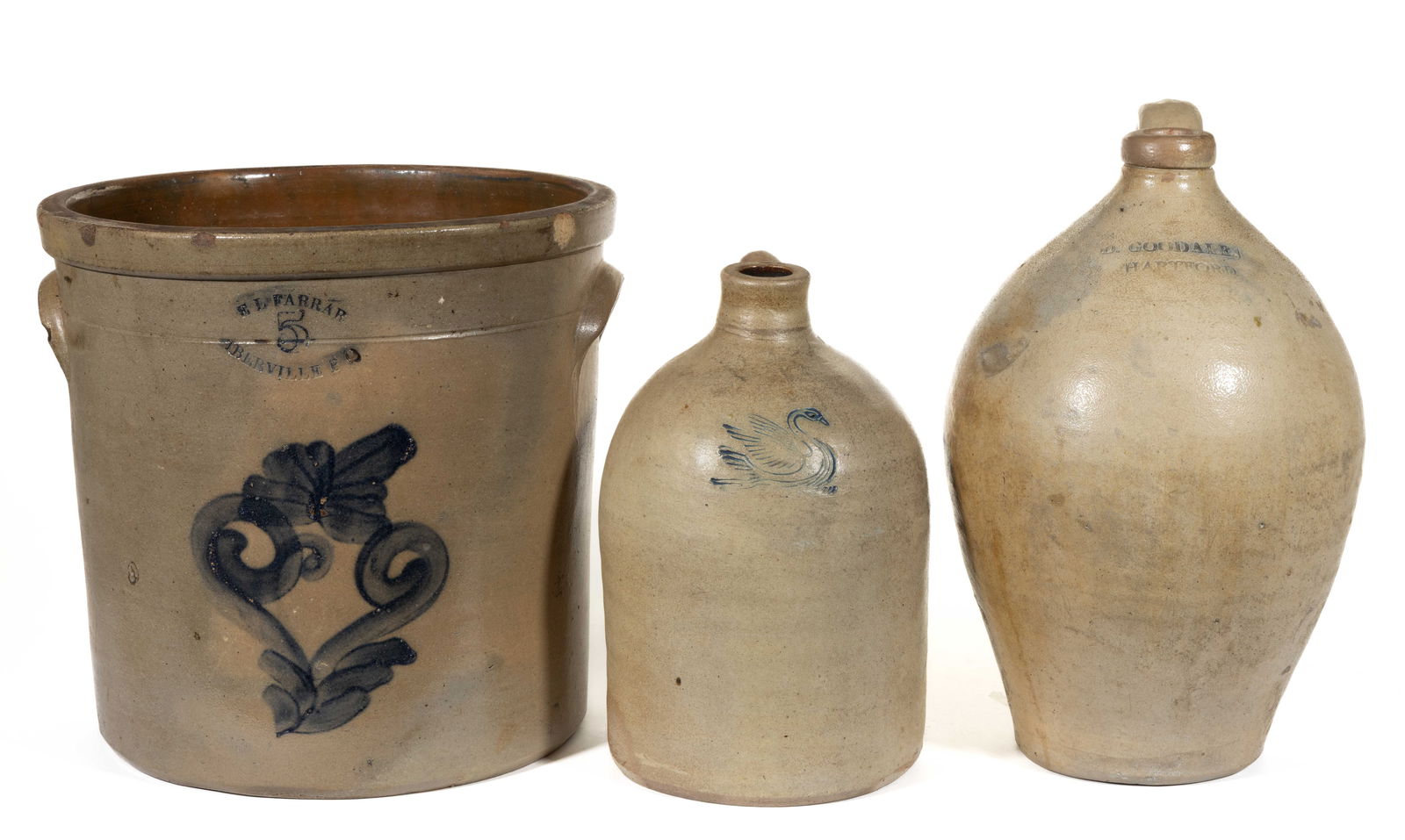 NORTHERN STONEWARE ARTICLES, LOT OF THREE: NORTHERN STONEWARE ARTICLES, LOT OF THREE, salt-glazed, comprising a "5" gallon capacity crock of wide-mouth form stamped "E L FARRAR / IBERVILLE P Q", having brushed cobalt styliz