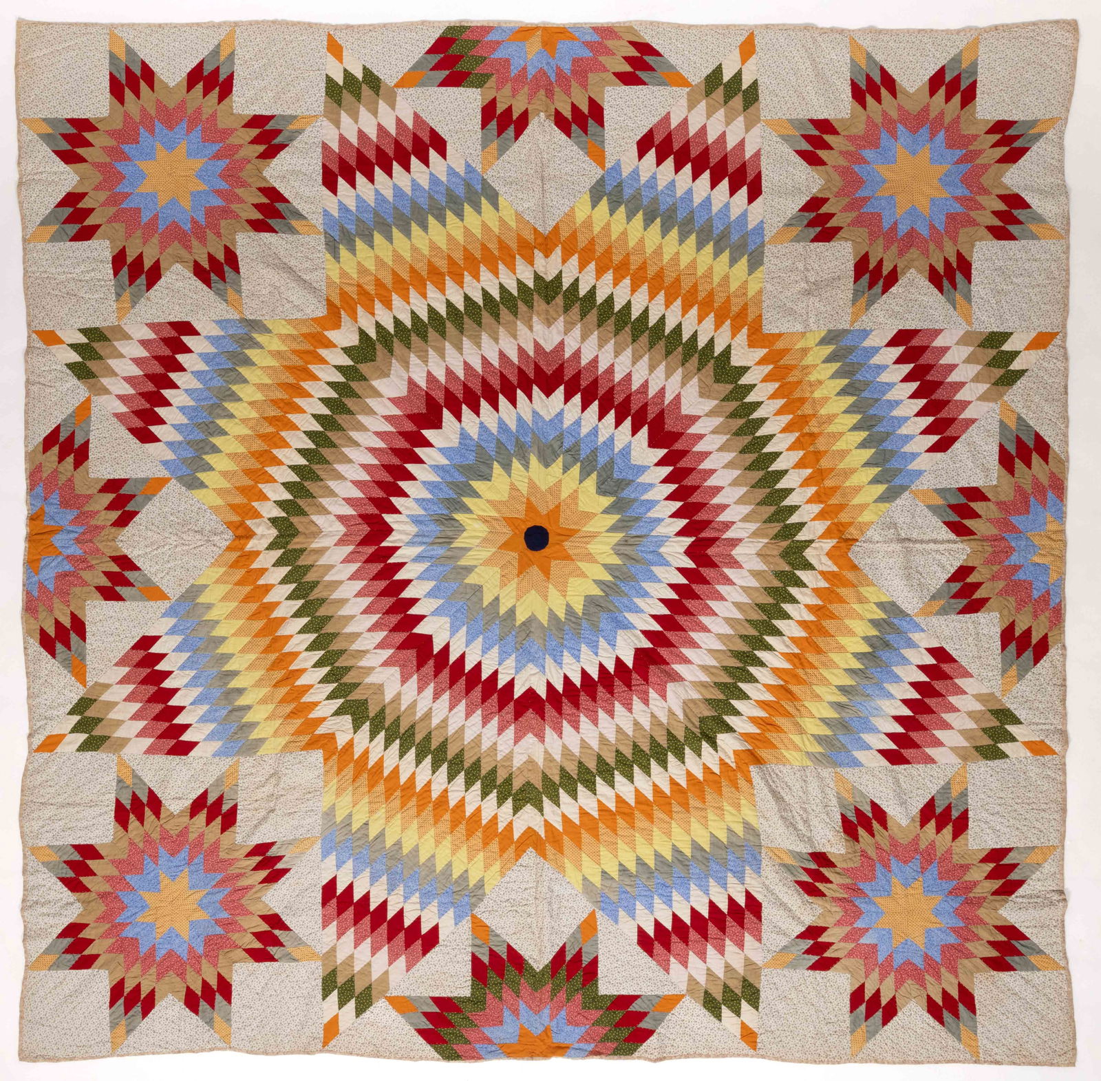 AMERICAN "LONE STAR / STAR OF BETHLEHEM" PIECED QUILT: AMERICAN "LONE STAR / STAR OF BETHLEHEM" PIECED QUILT, hand- and machine-stitched, completed in polychrome print and solid fabrics, center eight-point star formed by diamond-shaped blocks, c