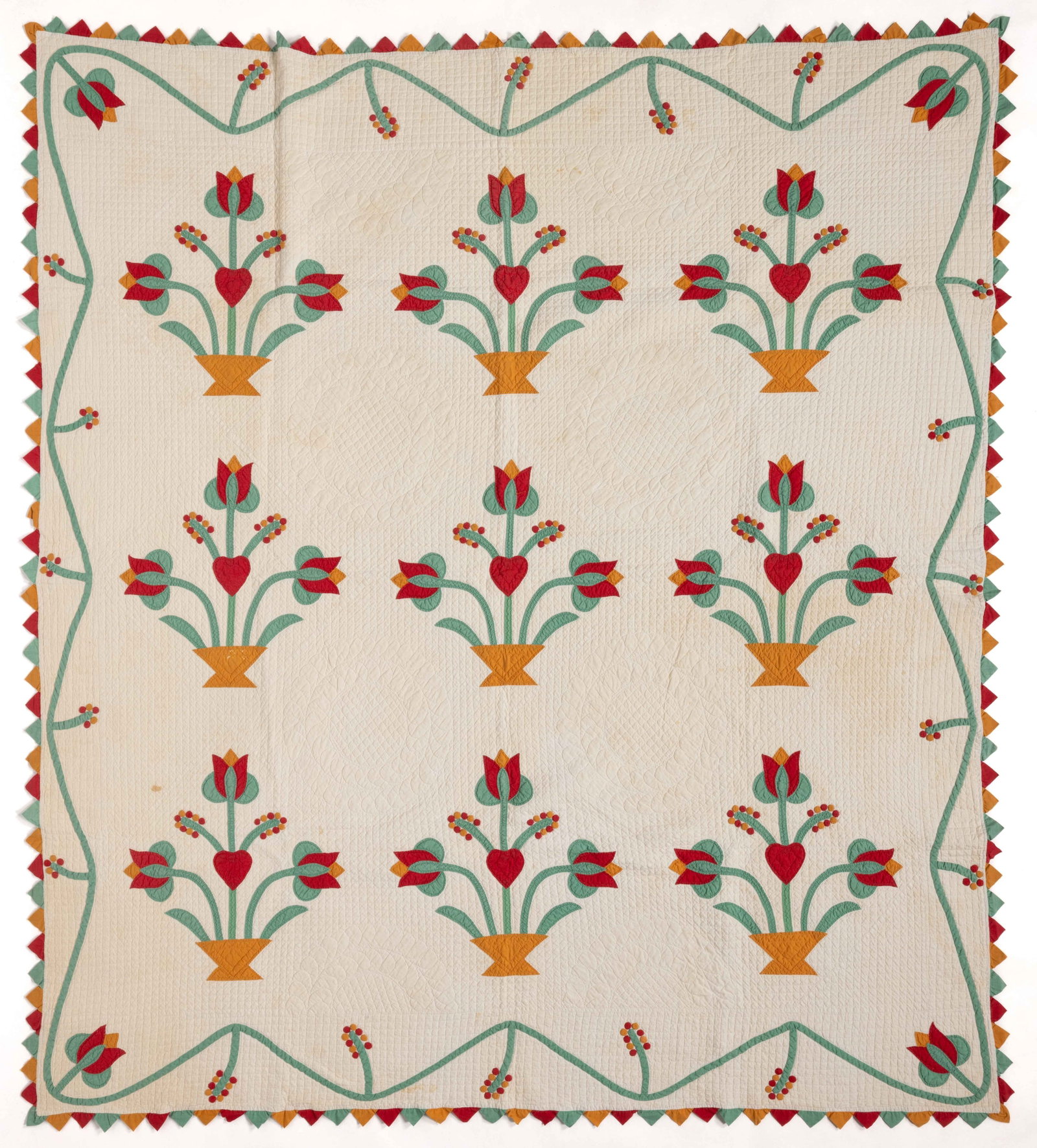 AMERICAN, POSSIBLY NEW YORK, FLOWER BASKET APPLIQUE AND TRAPUNTO QUILT: AMERICAN, POSSIBLY NEW YORK, FLOWER BASKET APPLIQUE AND TRAPUNTO QUILT, hand-stitched in white and color thread with machine-stitched seams, completed in solid red, green, orange/cheddar, and white fa