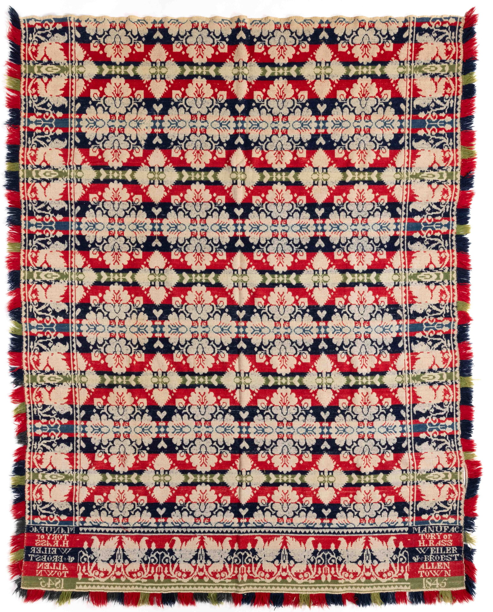 ALLENTOWN, PENNSYLVANIA SIGNED AND DATED JACQUARD COVERLET: ALLENTOWN, PENNSYLVANIA SIGNED AND DATED JACQUARD COVERLET, dark and medium blue, green, and rose red wool, and natural cotton, whole panel, center featuring repeated floral motif pattern, three