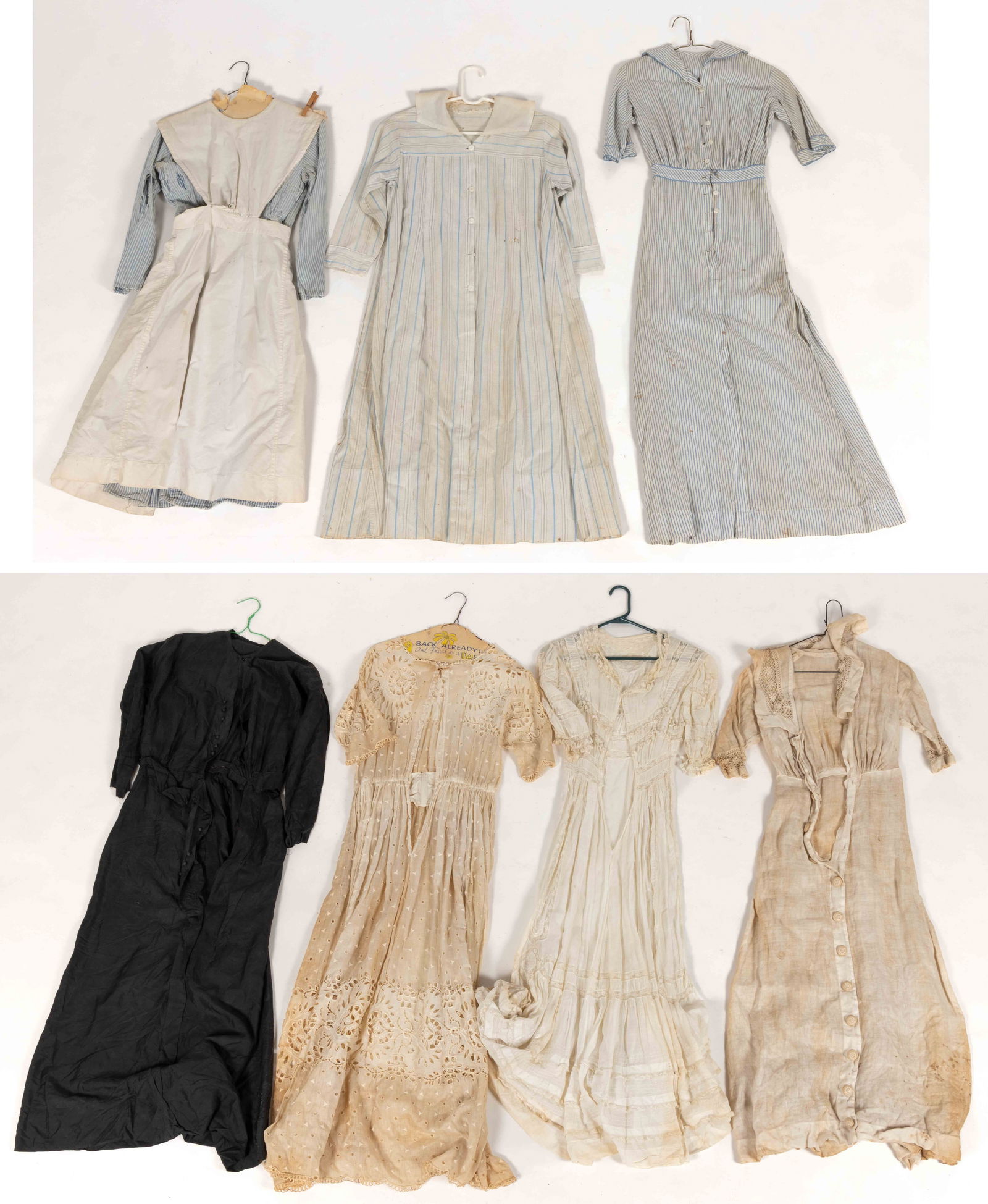 ANTIQUE / VINTAGE LADY'S DRESSES, LOT OF SEVEN: ANTIQUE / VINTAGE LADY'S DRESSES, LOT OF SEVEN, comprising two Victorian / Edwardian white cotton dresses with lace, a linen dress with lace accents and buttons down the front, a Victorian / Edwar