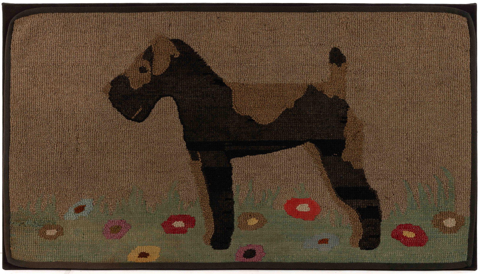 AMERICAN FOLK ART TERRIER DOG PICTORIAL HOOKED RUG: AMERICAN FOLK ART TERRIER DOG PICTORIAL HOOKED RUG, rectangular form, depicting a terrier dog with black and brown hair, stands on grass sprinkled with blooming flowers and a tannish brown background,