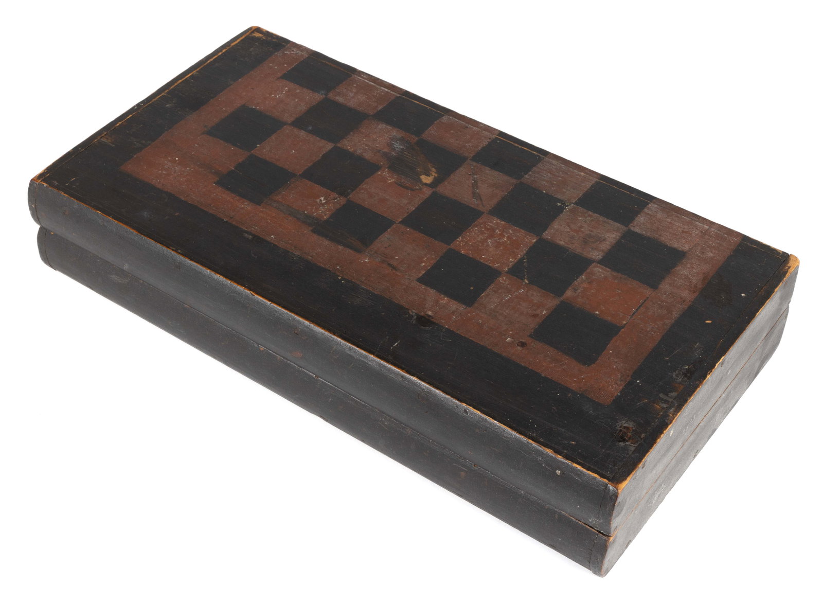 AMERICAN FOLK ART PAINTED FOLDING GAMEBOARD: AMERICAN FOLK ART PAINTED FOLDING GAMEBOARD, designed for checkers on the exterior and backgammon on the interior, retaining dry original red- and black-painted surface. Mid 19th century. 3" H, 1