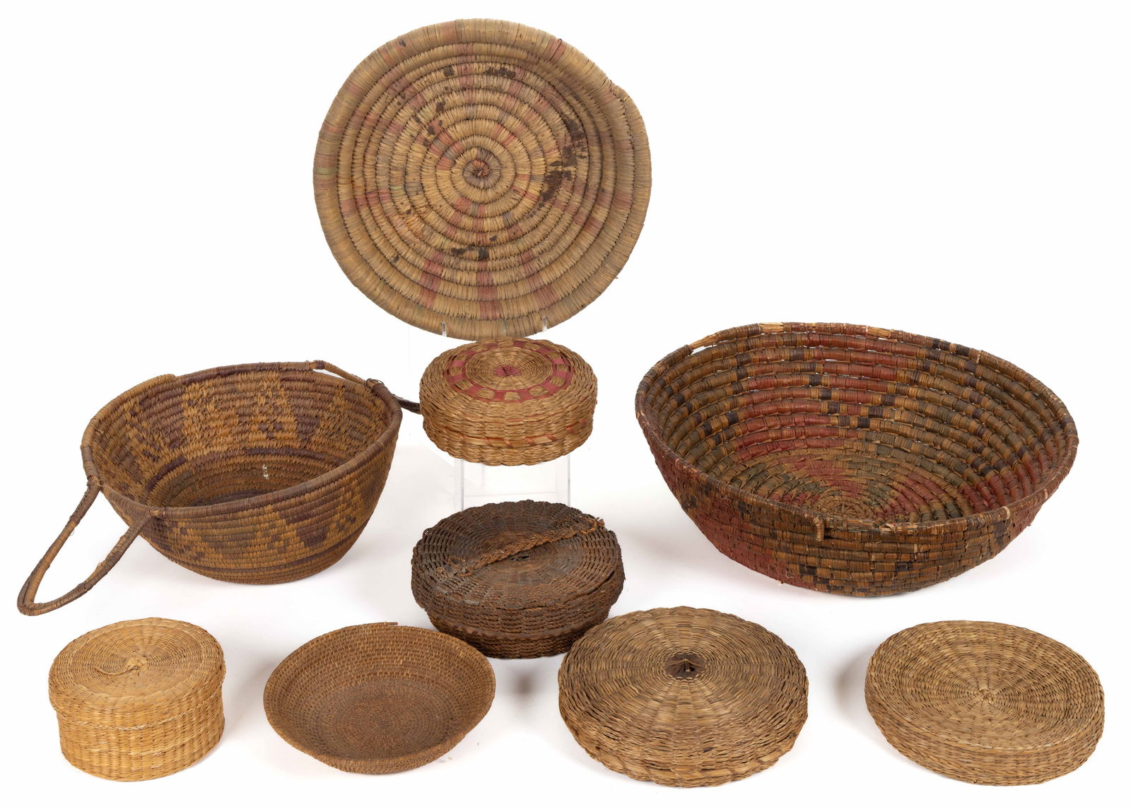 ASSORTED WOVEN-COIL AND OTHER BASKETS, LOT OF NINE: ASSORTED WOVEN-COIL AND OTHER BASKETS, LOT OF NINE, various materials with some having dyed-weaver decoration, comprising five covered baskets including one used as a sewing basket having some thread