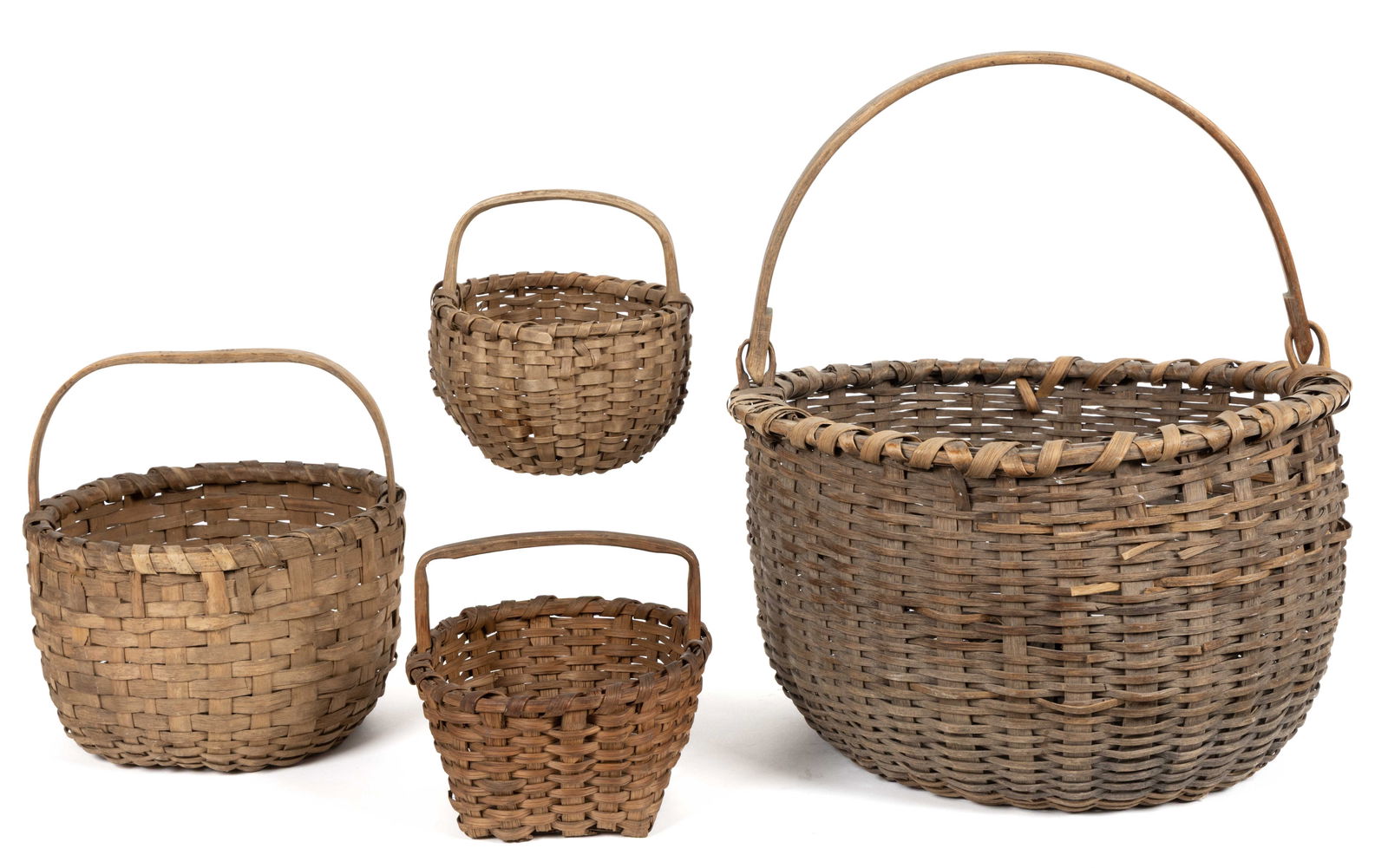 ASSORTED AMERICAN STAVE-TYPE WOVEN-SPLINT BASKETS, LOT OF FOUR: ASSORTED AMERICAN STAVE-TYPE WOVEN-SPLINT BASKETS, LOT OF FOUR, white oak and ash, comprising a large example in round form with a bail handle; a rounded example with a single-wrapped doubled-rim and